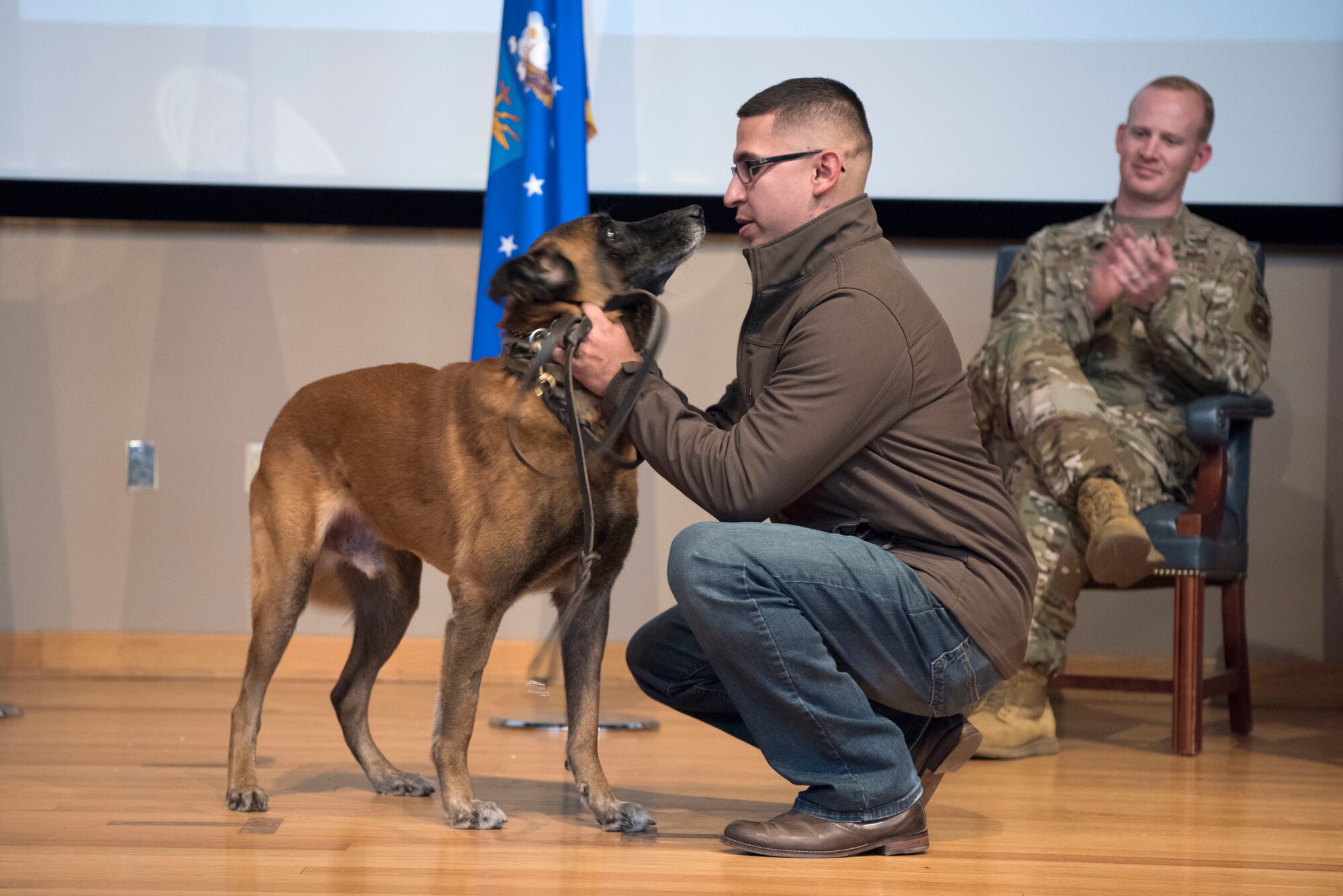 Jorge Cervantes Melchor, a former U.S. Air Force Security Forces member and military working dog Cchico's second handler, gives MWD Cchico, a retired 47th SFS military working dog, his first pet as a retired MWD Jan. 28, 2020, at Laughlin Air Force Base, Texas. Melchor now works as an animal cruelty investigator for the Houston Society for the Prevention of Cruelty to Animals. (U.S. Air Force photo by Senior Airman John A. Crawford)
