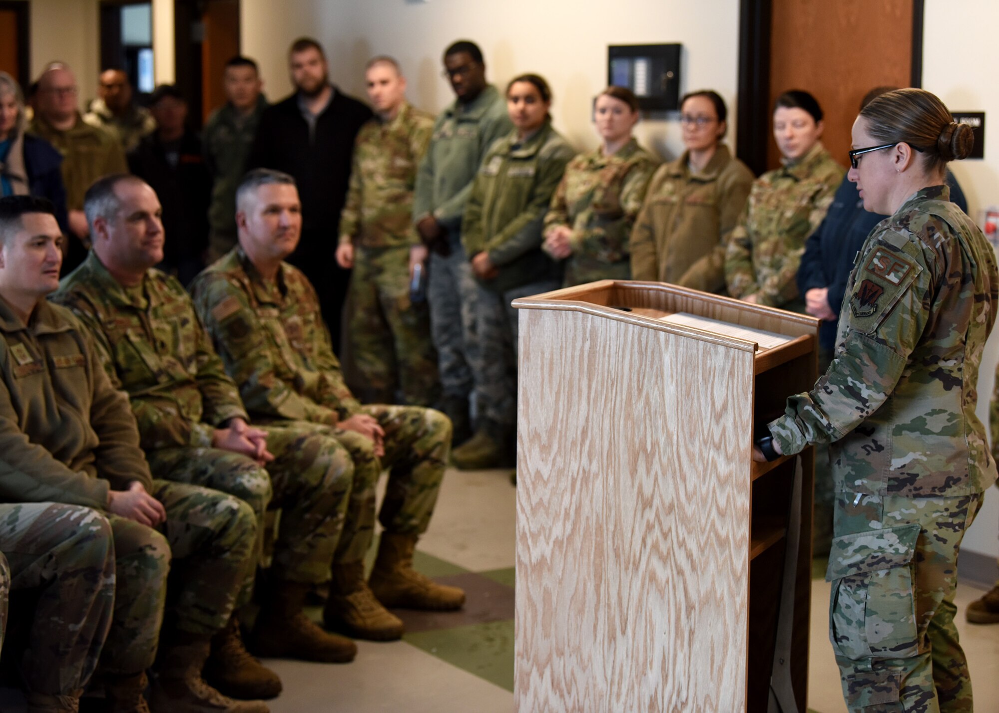 Staff Sgt. Sara Yandell, 319th Security Forces Squadron kennel master, addresses ceremony attendees before the grand-opening of a new K-9 facility at Grand Forks Air Force Base, N.D., Jan. 24, 2020. The facility provides a new work center for the staff and a new home for the military working dogs to help get the mission done on, and off the clock. (U.S. Air Force photo by Staff Sgt. Patrick A. Wyatt)