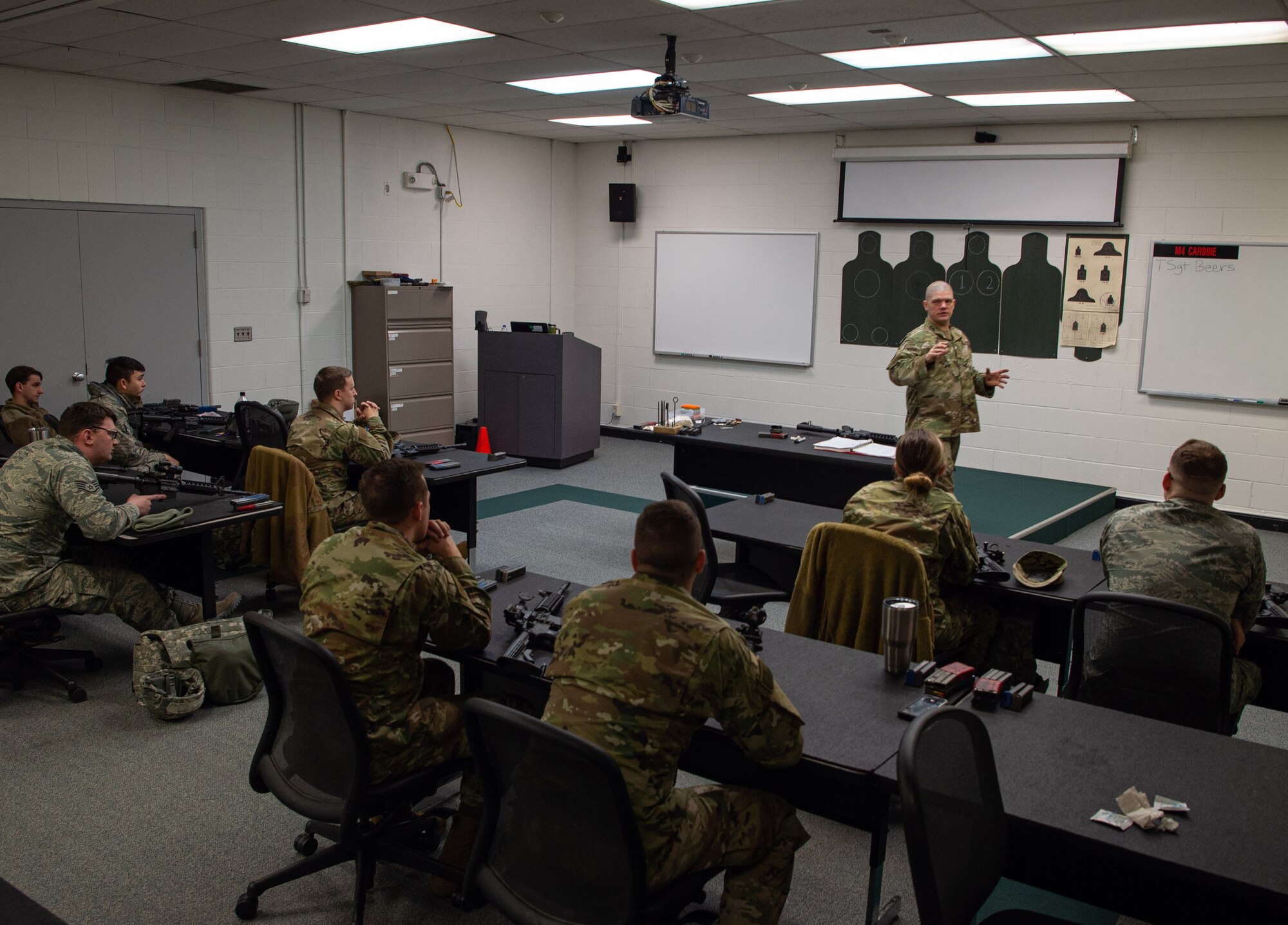Tech. Sgt. Kevin Beers, 446th Security Forces Squadron combat arms instructor, teaches students during a qualification course for the M-4 rifle at Joint Base Lewis-McChord, Wash., Jan. 23, 2020. During the course, students were taught how to position, load, chamber and clear malfunctions for M-4 rifles, along with four firing positions and how to shoot while wearing gear and a gas mask. (U.S. Air Force photo by Senior Airman Tryphena Mayhugh)