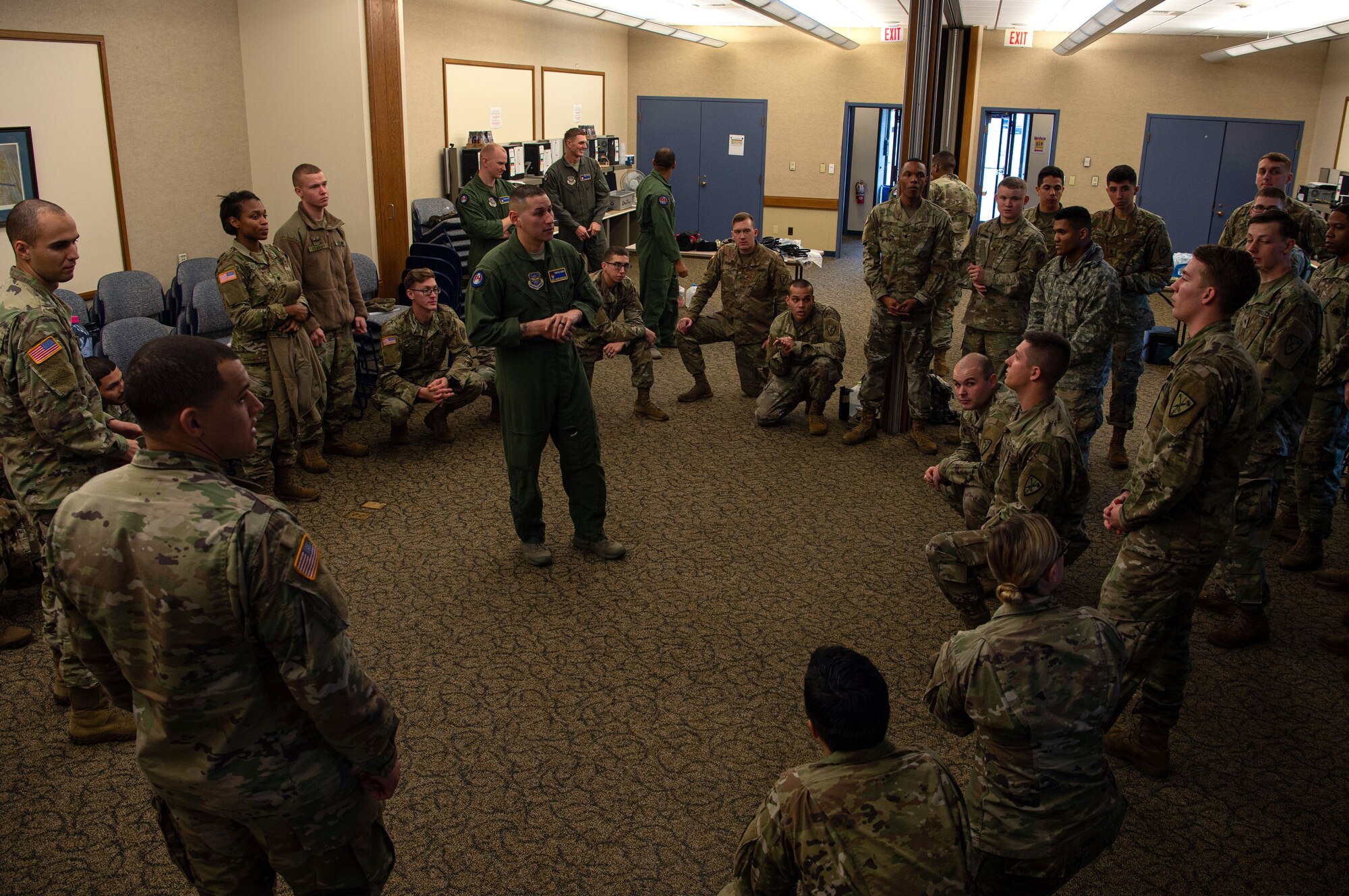 Master Sgt. Joseph Sorreno, 627th Security Forces Squadron Phoenix Ravens program manager, teaches a course on how to process and hold detainees to 595th Military Police Company, 508th Military Police Battalion Soldiers at Joint Base Lewis-McChord, Wash., Dec. 5, 2019. The Soldiers are deploying and their battalion decided to use the Air Force to cross train and see how the Air Force load and unload detainees. (U.S. Air Force photo by Senior Airman Tryphena Mayhugh)
