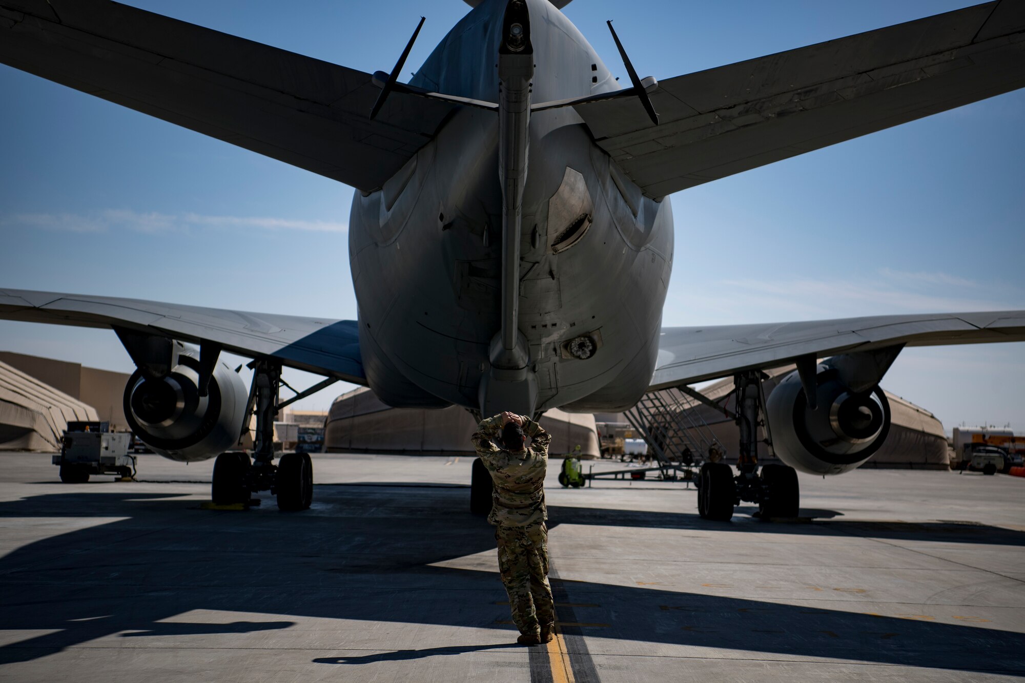 A U.S. Air Force flight engineer assigned to the 908th Expeditionary Air Refueling Squadron conducts preflight checks on a U.S. Air Force KC-10 Extender at Al Dhafra Air Base, United Arab Emirates Jan. 19, 2020.