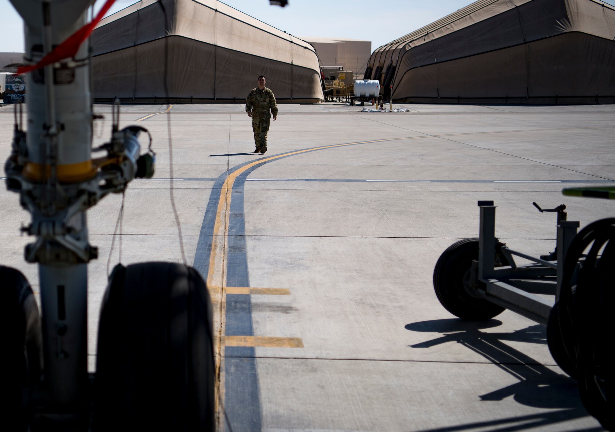 A U.S. Air Force flight engineer assigned to the 908th Expeditionary Air Refueling Squadron conducts preflight checks on a U.S. Air Force KC-10 Extender at Al Dhafra Air Base, United Arab Emirates Jan. 19, 2020.