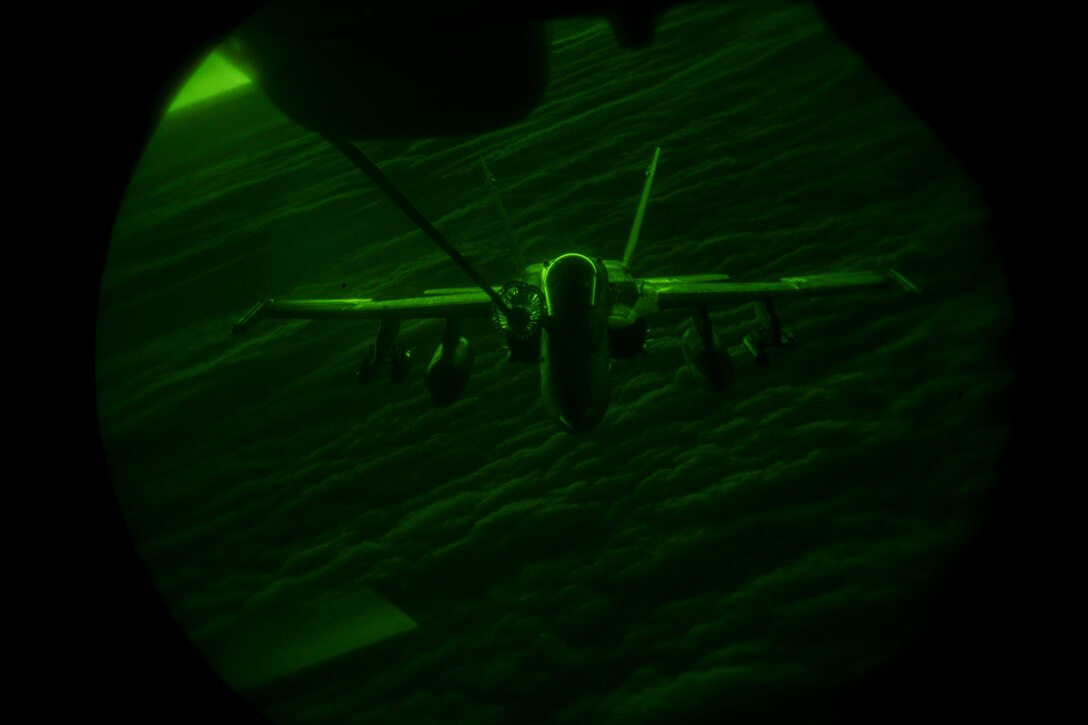 A U.S. Marine Corps F/A-18 Hornet assigned to Marine Fighter Attack Squadron (VMFA) 251 receives fuel from a U.S. Air Force KC-10 Extender assigned to the 908th Expeditionary Air Refueling Squadron above the U.S. Central Command area of responsibility, Jan. 22, 2020.