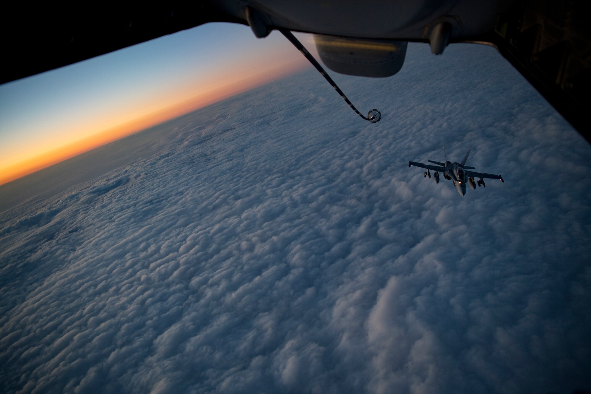 A U.S. Marine Corps F/A-18 Hornet assigned to Marine Fighter Attack Squadron (VMFA) 251 approaches a U.S. Air Force KC-10 Extender assigned to the 908th Expeditionary Air Refueling Squadron to receive fuel above the U.S. Central Command area of responsibility, Jan. 22, 2020.