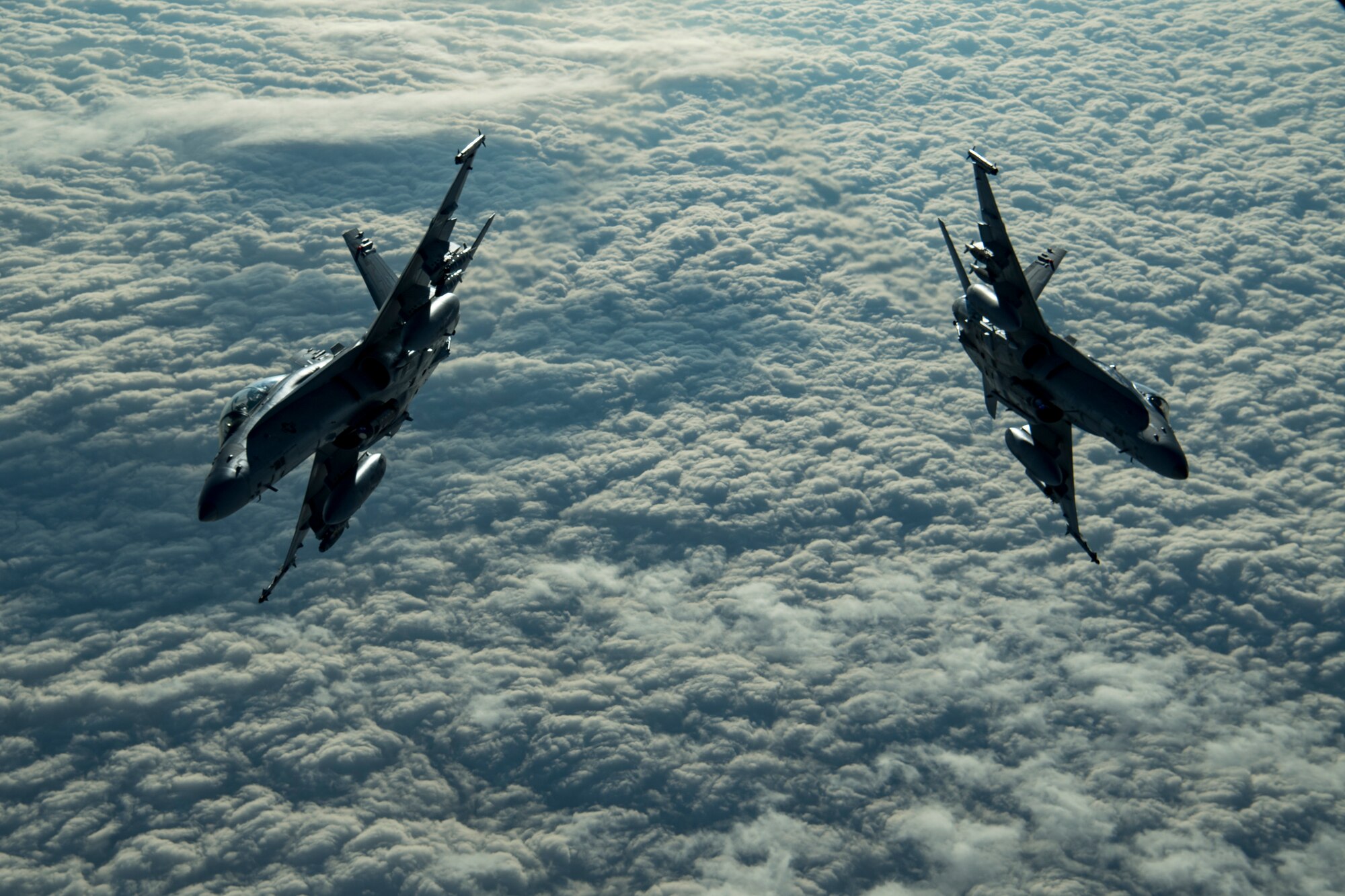 Two U.S. Marine Corps F/A-18 Hornets assigned to Marine Fighter Attack Squadron (VMFA) 251 fly above the U.S. Central Command area of responsibility, Jan. 17, 2020.