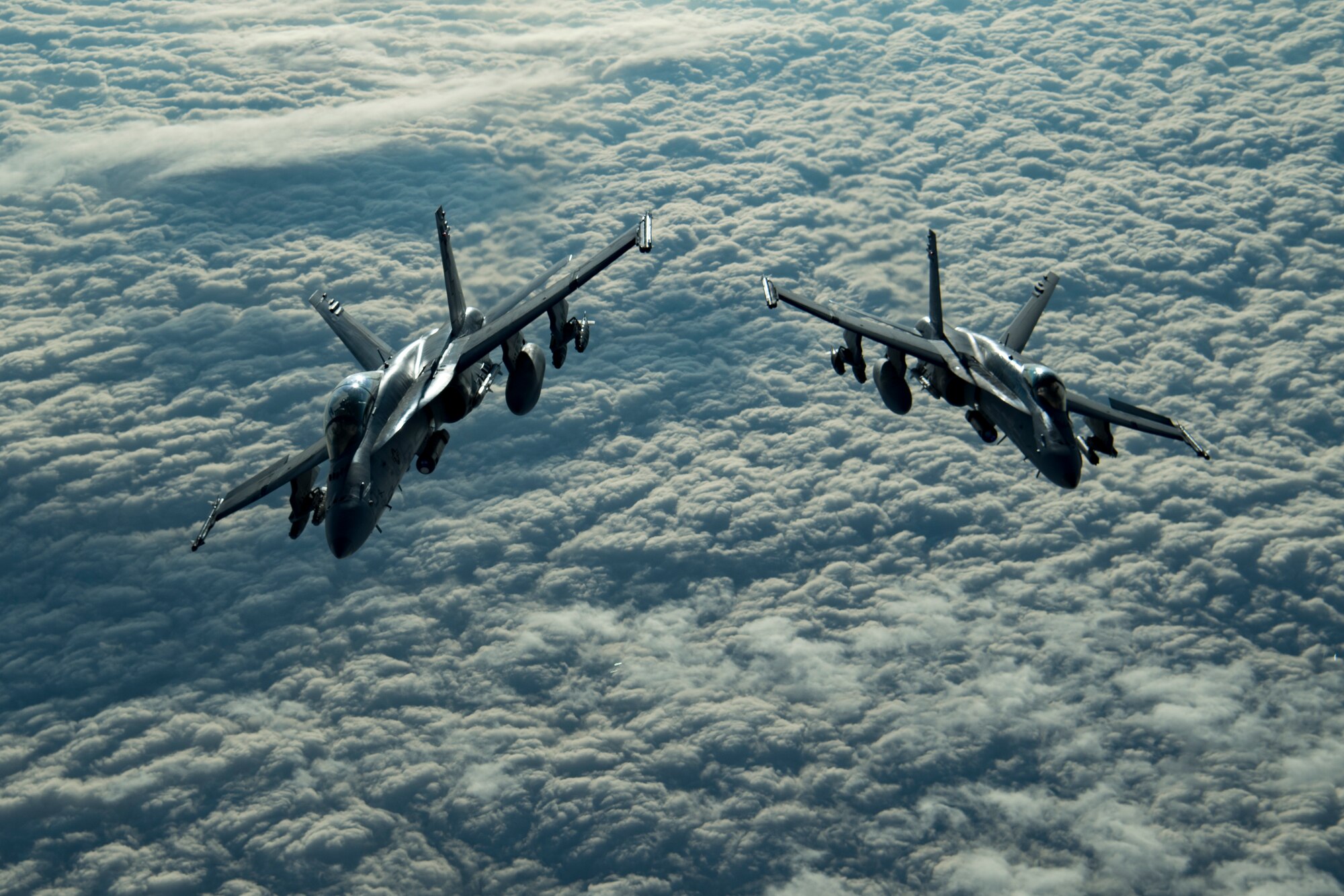 Two U.S. Marine Corps F/A-18 Hornets assigned to Marine Fighter Attack Squadron (VMFA) 251 fly above the U.S. Central Command area of responsibility, Jan. 17, 2020.