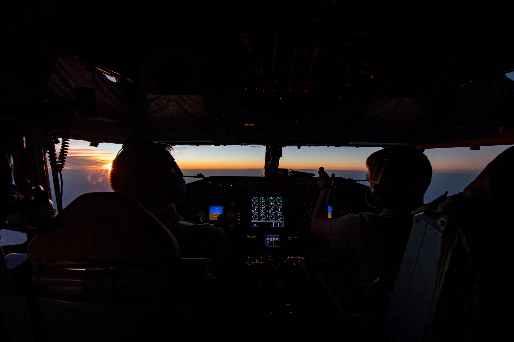 U.S. Air Force KC-135 Stratotanker pilots assigned to the 28th Expeditionary Air Refueling Squadron converse while flying in the U.S. Central Command area of operation, Jan. 3, 2020.