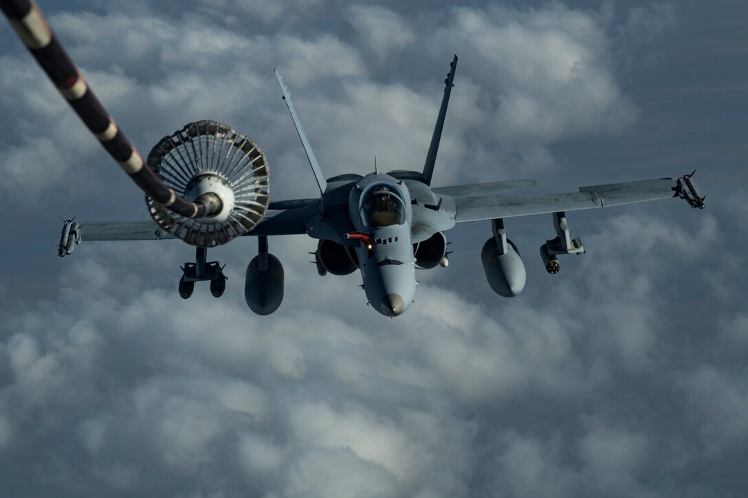 A U.S. Marine Corps F/A-18 Hornet assigned to Marine Fighter Attack Squadron (VMFA) 251 approaches a U.S. Air Force KC-10 Extender assigned to the 908th Expeditionary Air Refueling Squadron to receive fuel above the U.S. Central Command area of responsibility, Jan. 22, 2020.