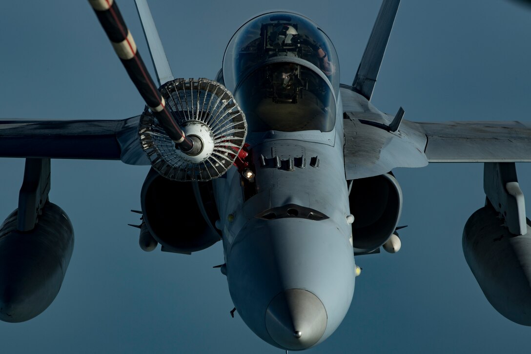 A U.S. Marine Corps F/A-18 Hornet assigned to Marine Fighter Attack Squadron (VMFA) 251 receives fuel from a U.S. Air Force KC-10 Extender assigned to the 908th Expeditionary Air Refueling Squadron above the U.S. Central Command area of responsibility, Jan. 22, 2020.