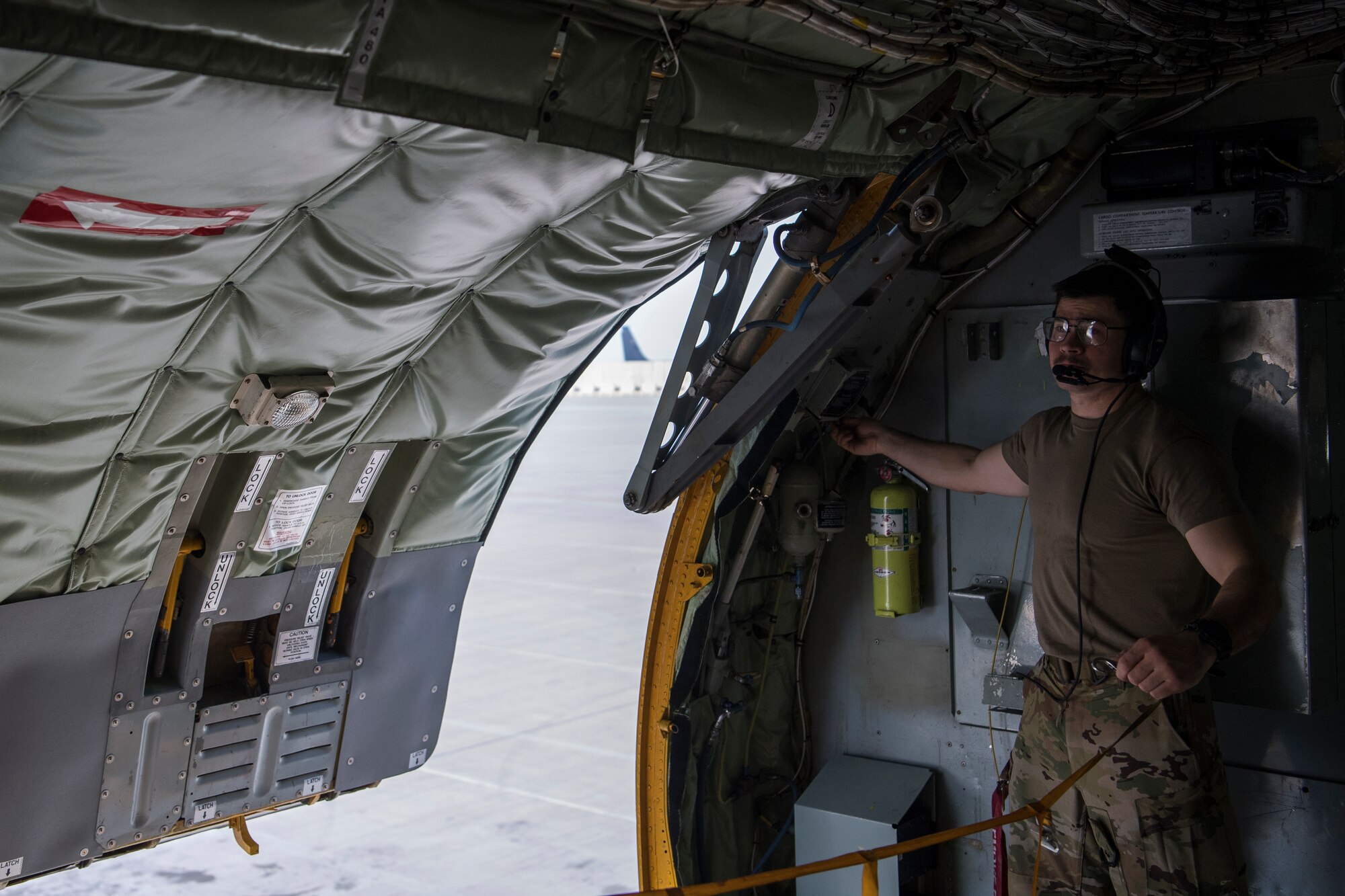 A U.S. Air Force KC-135 Stratotanker boom operator assigned to the 28th Expeditionary Air Refueling Squadron performs preflight inspections at Al Udeid Air Base, Qatar, Jan. 3, 2020.