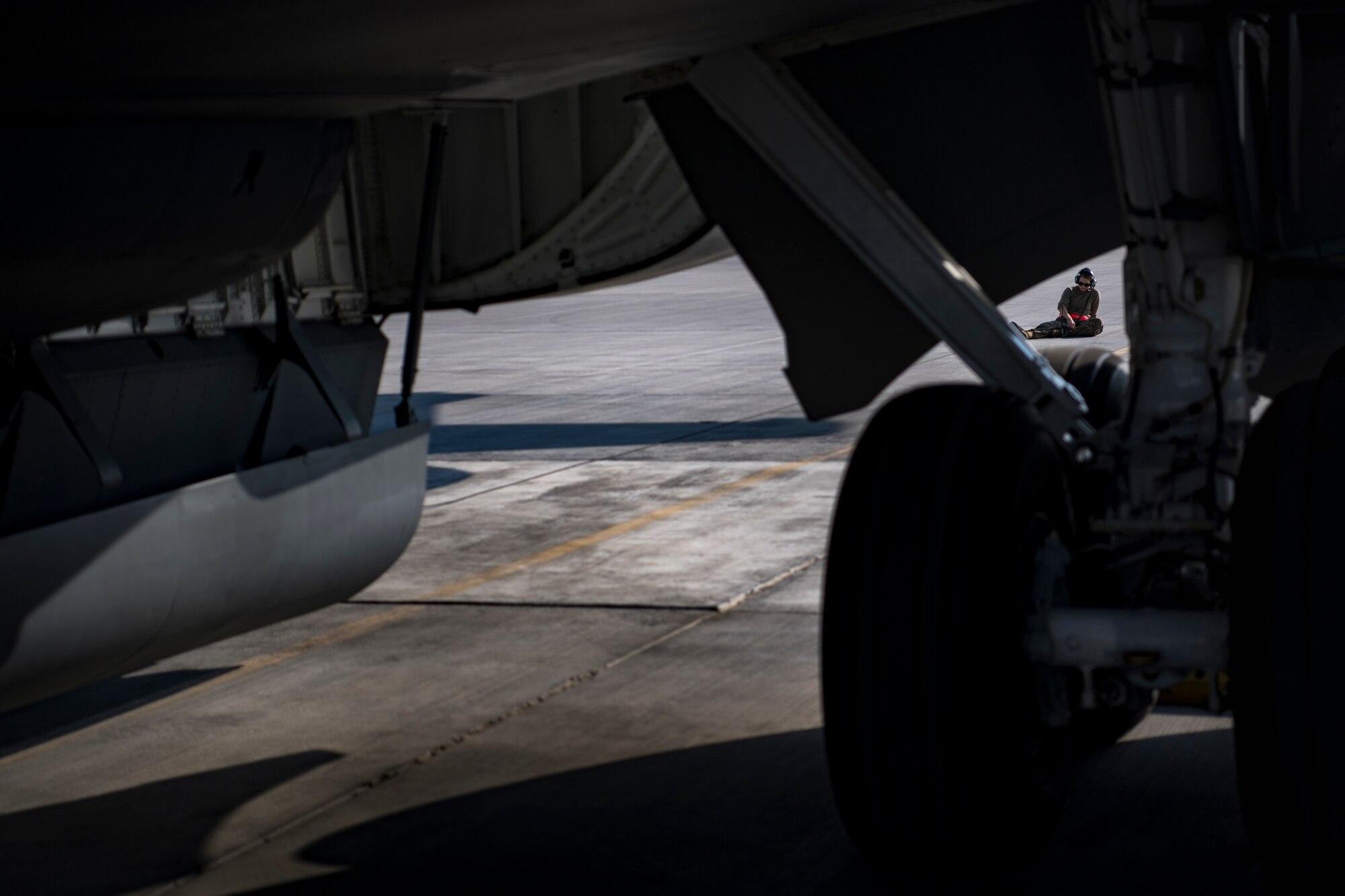 A U.S. Air Force KC-135 Stratotanker crew chief assigned to the 385th Expeditionary Aircraft Maintenance Squadron waits to begin a preflight inspection at Al Udeid Air Base, Qatar, Jan. 3, 2020,