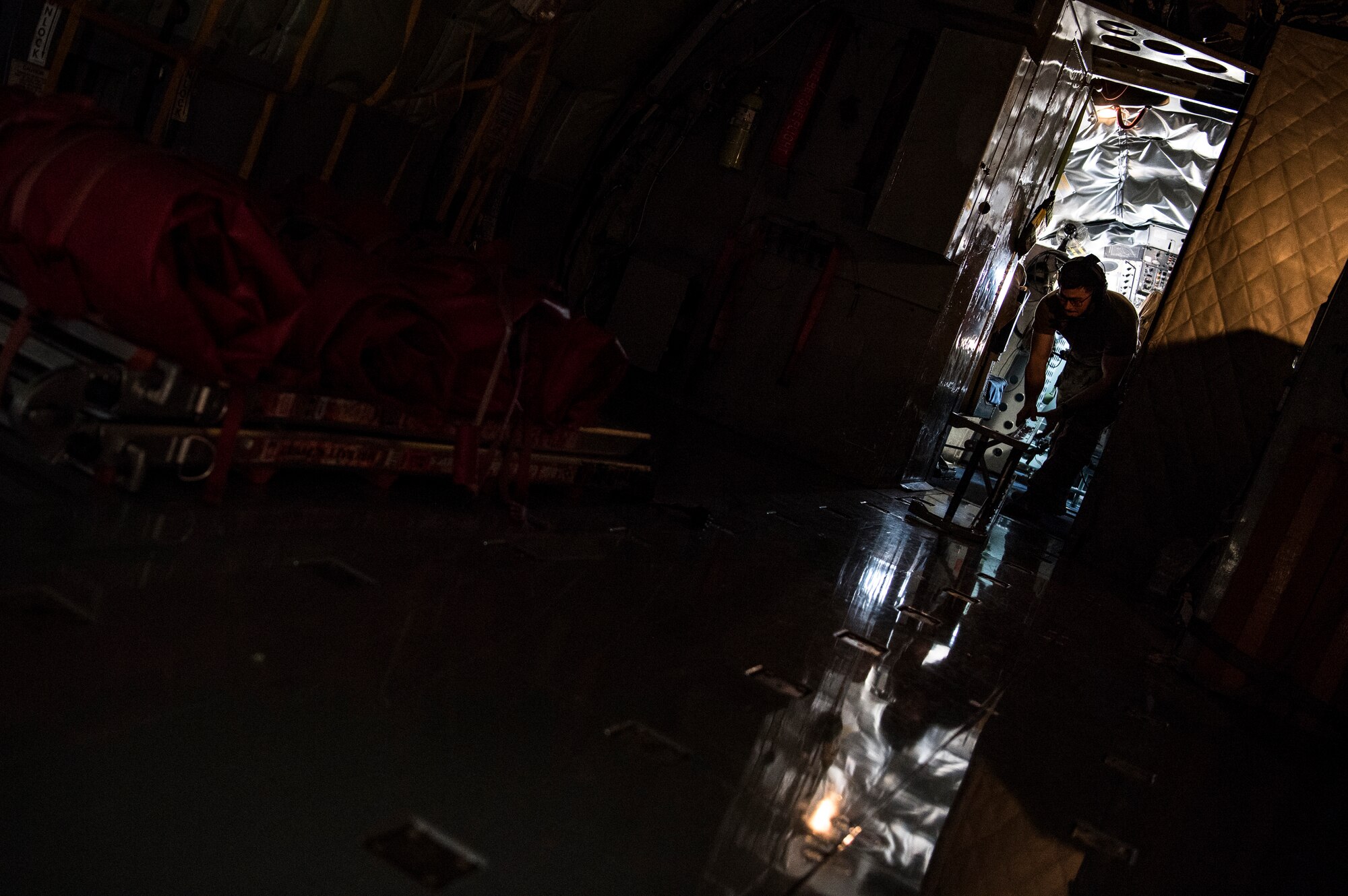 A U.S. Air Force KC-135 Stratotanker boom operator assigned to the 28th Expeditionary Air Refueling Squadron performs preflight procedures at Al Udeid Air Base, Qatar, Jan. 3, 2020.
