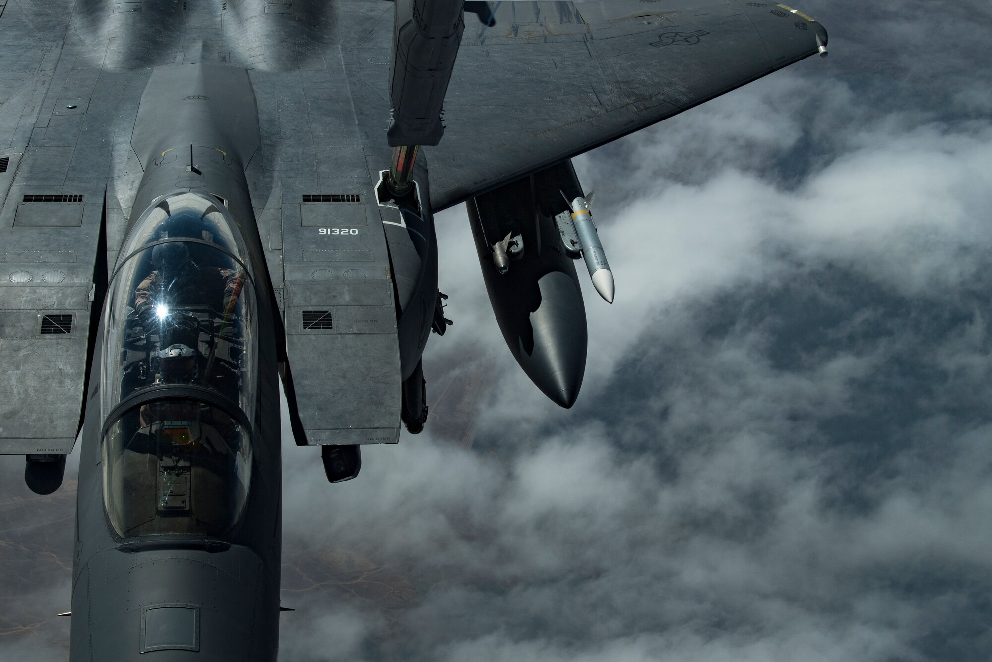 A U.S. Air Force F-15E Strike Eagle assigned to the 494th Expeditionary Fighter Squadron receives fuel from a U.S. Air Force KC-10 Extender assigned to the 908th Expeditionary Air Refueling Squadron above the U.S. Central Command area of responsibility, Jan. 15, 2020.