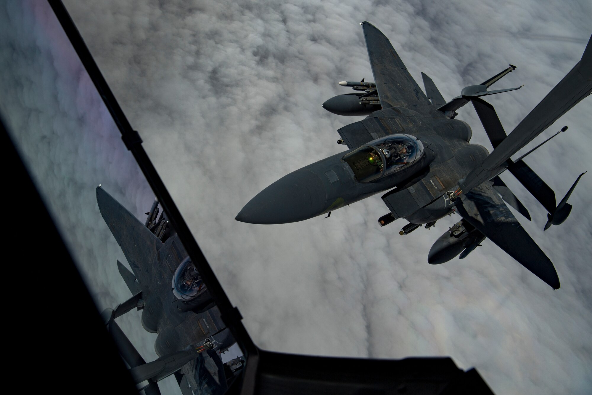 A U.S. Air Force F-15E Strike Eagle assigned to the 494th Expeditionary Fighter Squadron receives fuel from a U.S. Air Force KC-10 Extender assigned to the 908th Expeditionary Air Refueling Squadron above the U.S. Central Command area of responsibility, Jan. 15, 2020.