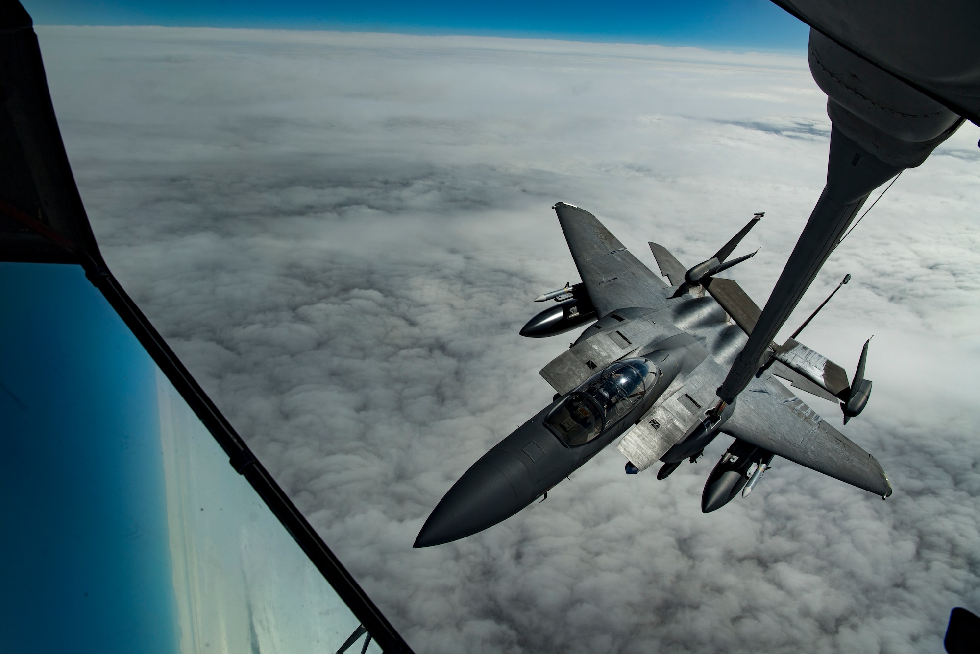 A U.S. Air Force F-15E Strike Eagle assigned to the 494th Expeditionary Fighter Squadron receives fuel from a U.S. Air Force KC-10 Extender assigned to the 908th Expeditionary Air Refueling Squadron above the U.S. Central Command area of responsibility, Jan. 15, 2020.