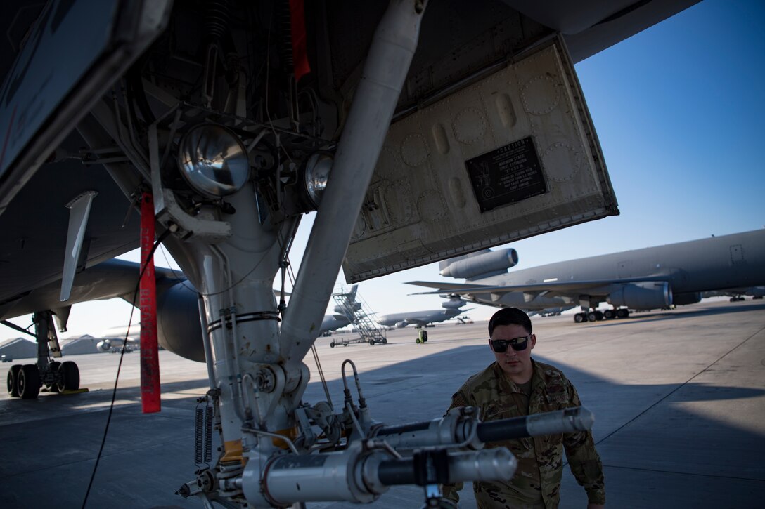 A U.S. Air Force flight engineer assigned to the 908th Expeditionary Air Refueling Squadron conducts preflight checks on a KC-10 Extender at Al Dhafra Air Base, United Arab Emirates Jan. 17, 2020.