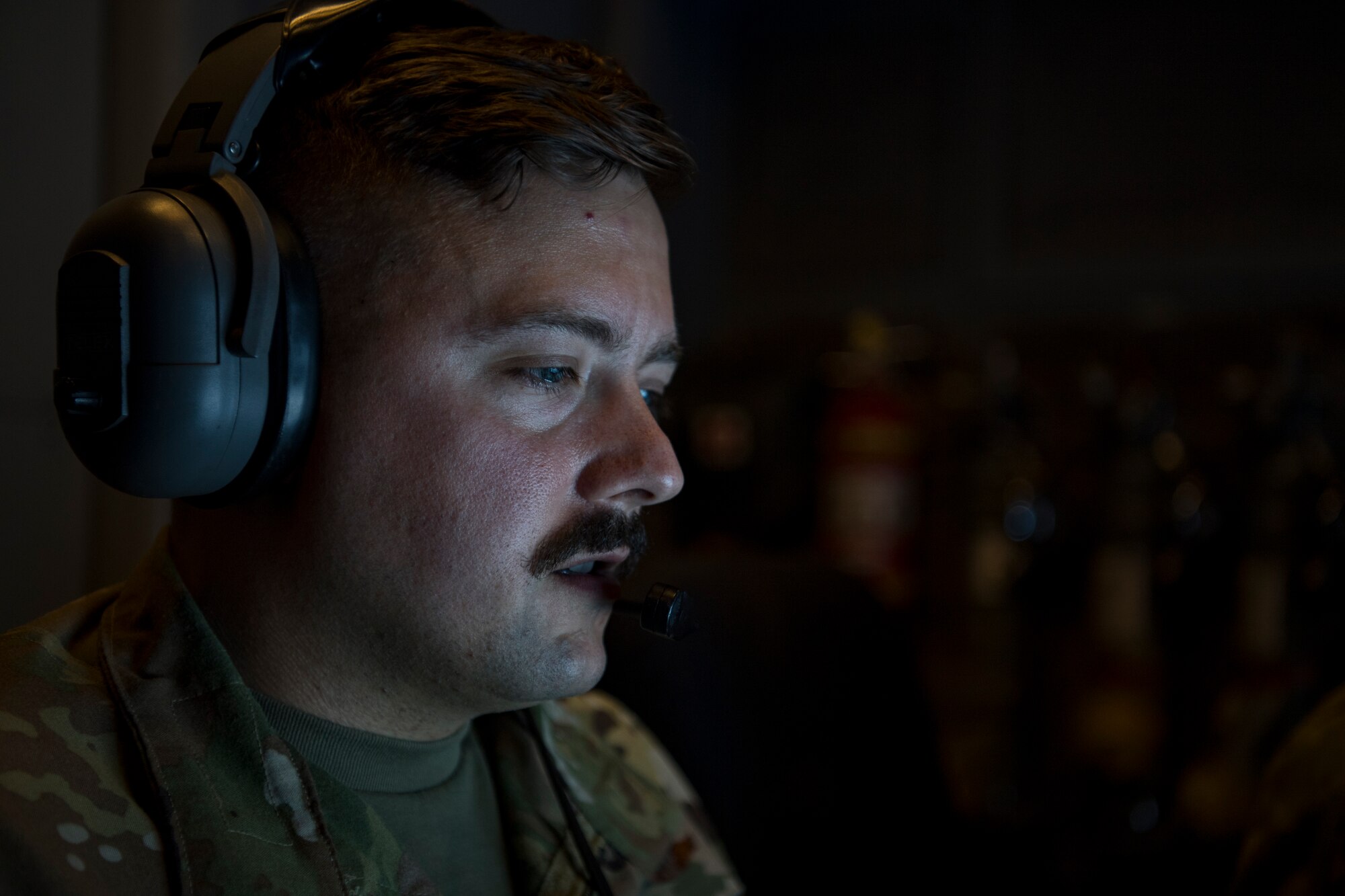 A U.S. Air Force KC-10 Extender in-flight refueling specialist assigned to the 908th Expeditionary Air Refueling Squadron, deployed to Al Dhafra Air Base, United Arab Emirates, conducts an aerial refueling above the U.S. Central Command area of responsibility, Jan. 17, 2020.