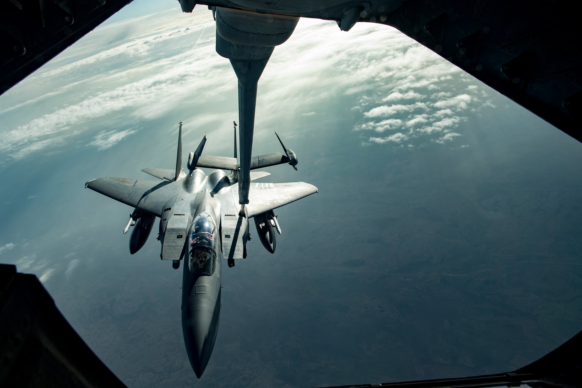 A U.S. Air Force F-15E Strike Eagle assigned to the 494th Expeditionary Fighter Squadron receives fuel from a U.S. Air Force KC-10 Extender assigned to the 908th Expeditionary Air Refueling Squadron above the U.S. Central Command area of responsibility, Jan. 19, 2020.