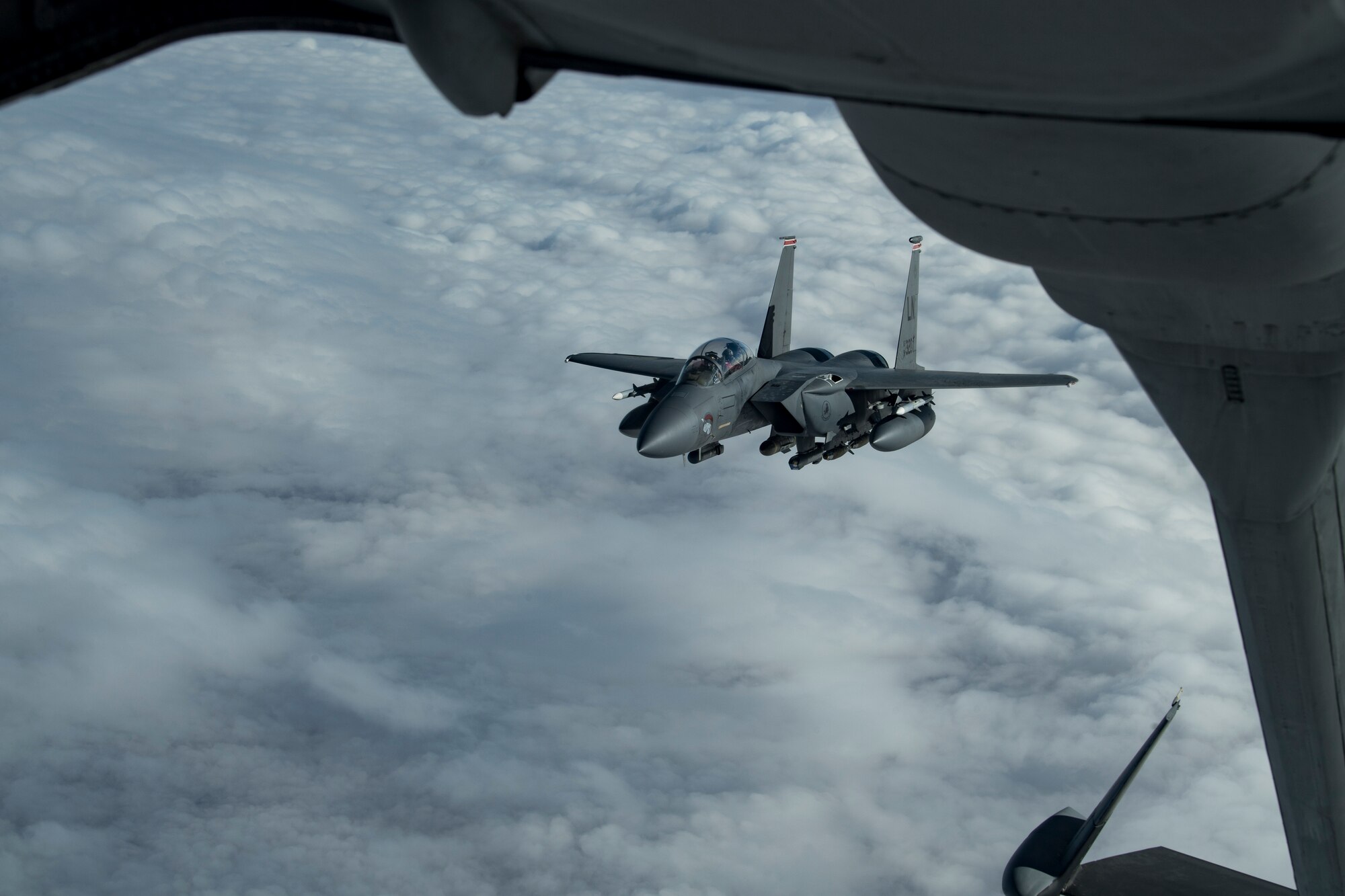 A U.S. Air Force F-15E Strike Eagle assigned to the 494th Expeditionary Fighter Squadron approaches a U.S. Air Force KC-10 Extender assigned to the 908th Expeditionary Air Refueling Squadron to receive fuel above the U.S. Central Command area of responsibility, Jan. 19, 2020.