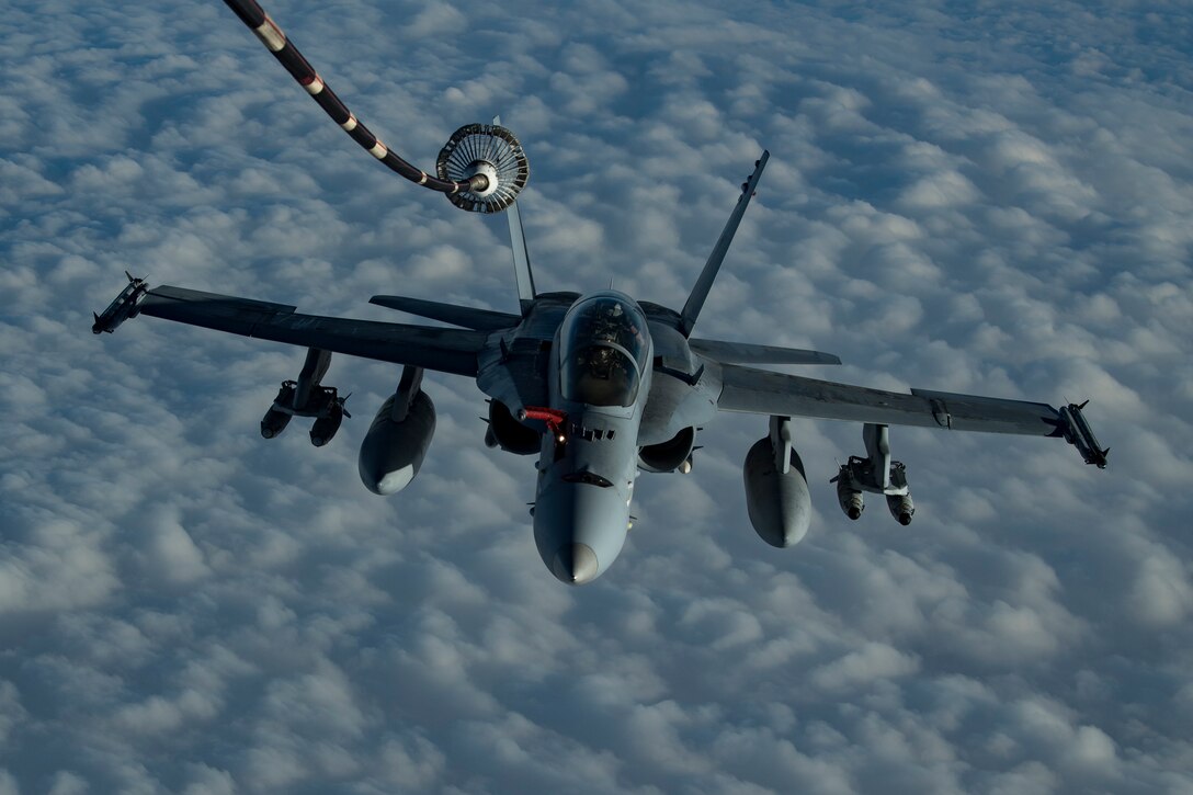 A U.S. Marine Corps F/A-18 Hornet assigned to Marine Fighter Attack Squadron (VMFA) 251 approaches a U.S. Air Force KC-10 Extender assigned to the 908th Expeditionary Air Refueling Squadron to receive fuel above the U.S. Central Command area of responsibility, Jan. 22, 2020.
