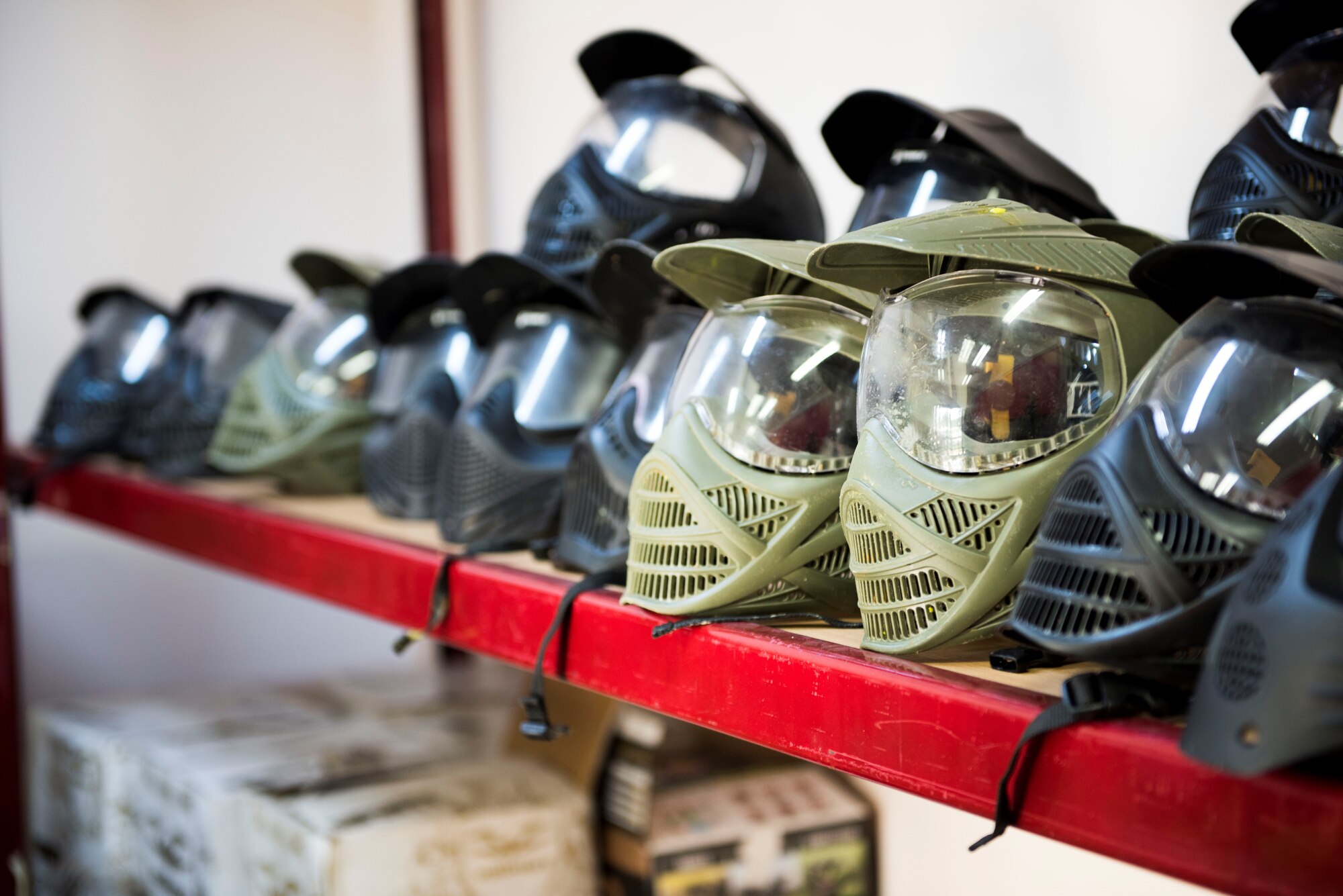 Paintball helmets sit on display at the Outdoor Recreation Center