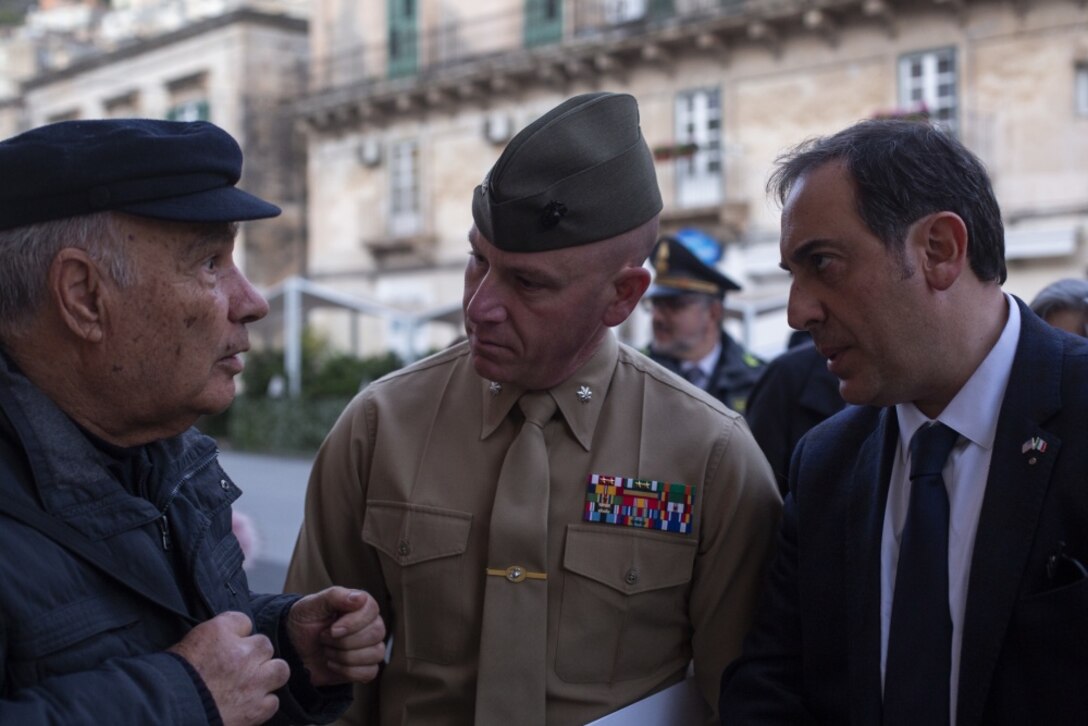 Lt. Col. Daniel Rosenberg, center, commanding officer of the Logistic Combat Element of Special Purpose Marine Air-Ground Task Force - Crisis Response – Africa 20.1, Marine Forces Europe and Africa, speaks to a local resident during a community relations event in Modica, Italy, Jan. 27, 2020. SPMAGTF-CR-AF is deployed to conduct crisis-response and theater-security operations in Africa and promote regional stability by conducting military-to-military training exercises throughout Europe and Africa. (U.S. Marine Corps photo by Cpl. Nello Miele)