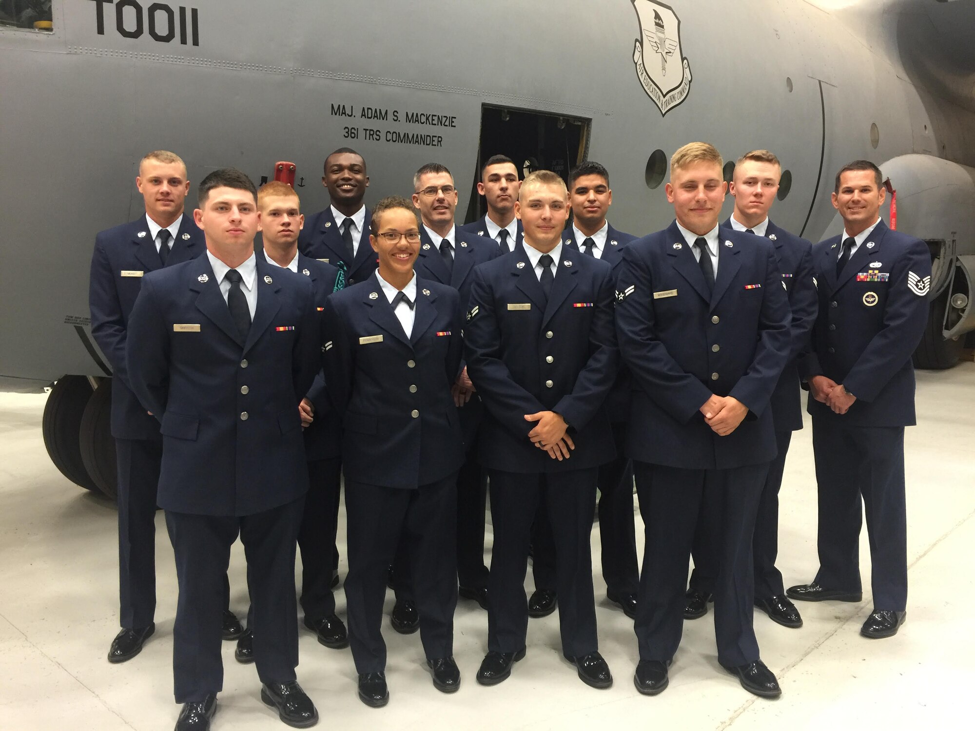 Then U.S. Air Force Tech. Sgt. Hollie McCaleb (far right) Air Education and Training Command instructor, poses for a photo with his class at Sheppard Air Force Base, Texas on May 23, 2016. McCaleb taught over 900 students about maintenance processes.