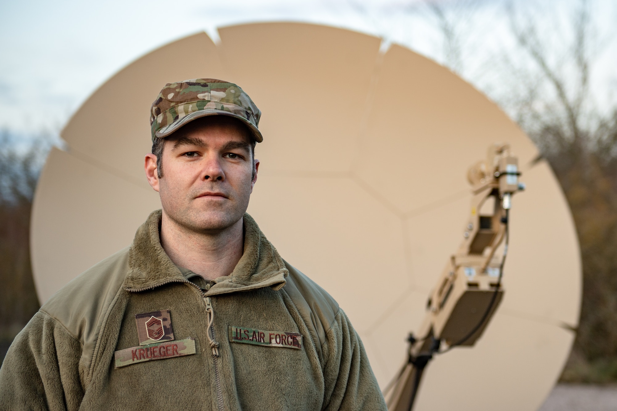 U.S. Air Force Chief Master Sgt. Brandon Krueger, 1st Combat Communications Squadron operations superintendent, poses for a photo during exercise Heavy Rain in Grostenquin, France, Jan. 15, 2020. During the exercise, Krueger observed 1st CBCS Airmen and provided feedback in dealing with a contested communications environment. (U.S. Air Force photo by Staff Sgt. Devin Boyer)