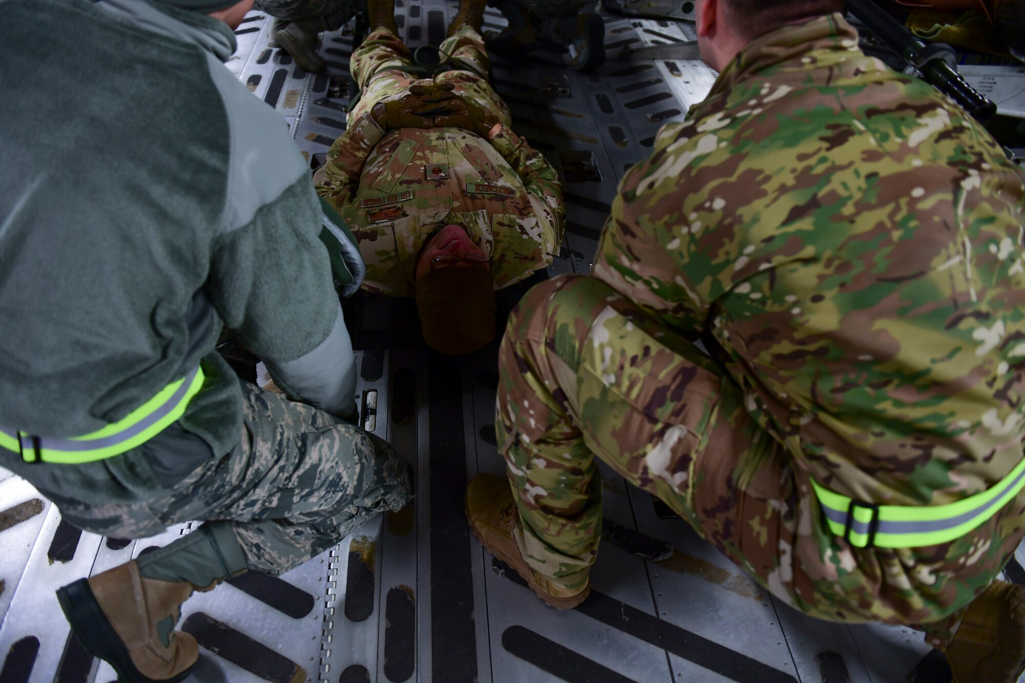 Maj. Paul Blycheck, flight nurse with the 911th Aeromedical Evacuation Squadron, acts as a patient for 911th AES personnel at the Pittsburgh International Airport Air Reserve Station, Pennsylvania, Jan. 16, 2020.