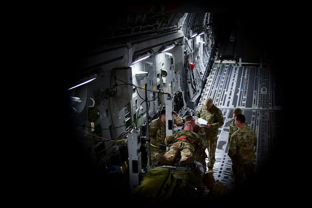 Members of the 911th Aeromedical Evacuation Squadron secure simulated patient Maj. Paul Blycheck, flight nurse with the 911th AES at the Pittsburgh International Airport Air Reserve Station, Pennsylvania, Jan. 16, 2020.