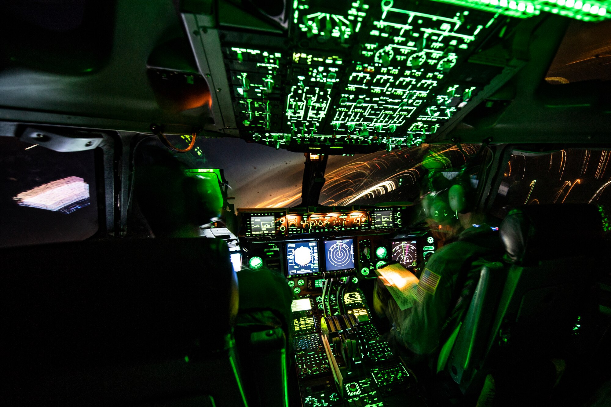 Maj. Jacob Predis, 758th Airlift Squadron pilot, and Col. John F. Robinson, 911th Airlift Wing commander, make a midair turn during a flight over Pittsburgh, Pennsylvania, Jan. 16, 2020. The flight provided vital training for aircrew members including nighttime touch-and-go practice at Wright-Patterson Air Force Base, Ohio.