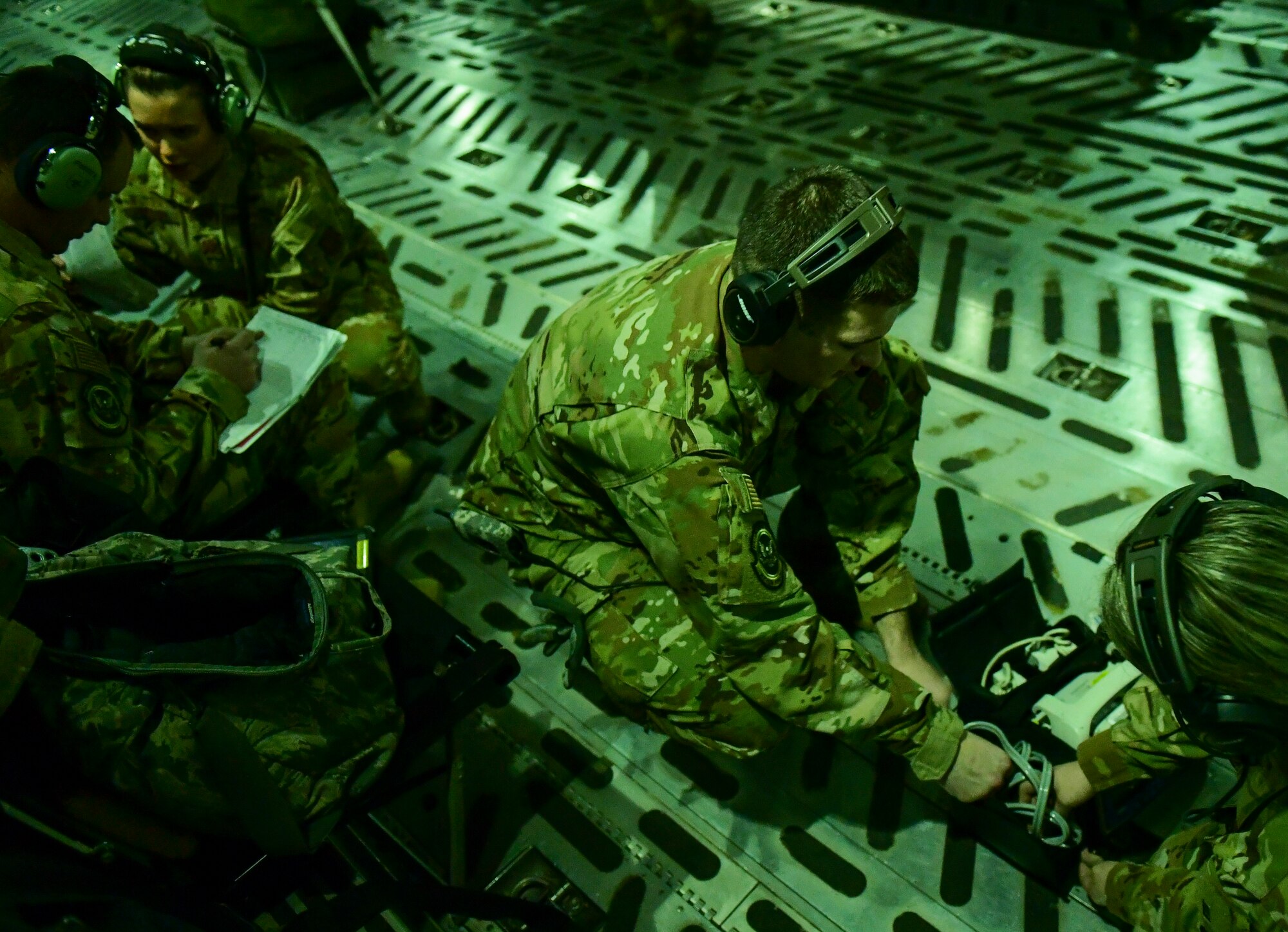 Members of the 911th Aeromedical Evacuation Squadron pack medical equipment on a C-17 Globemaster III during a training mission over Ohio, Jan. 16, 2020.
