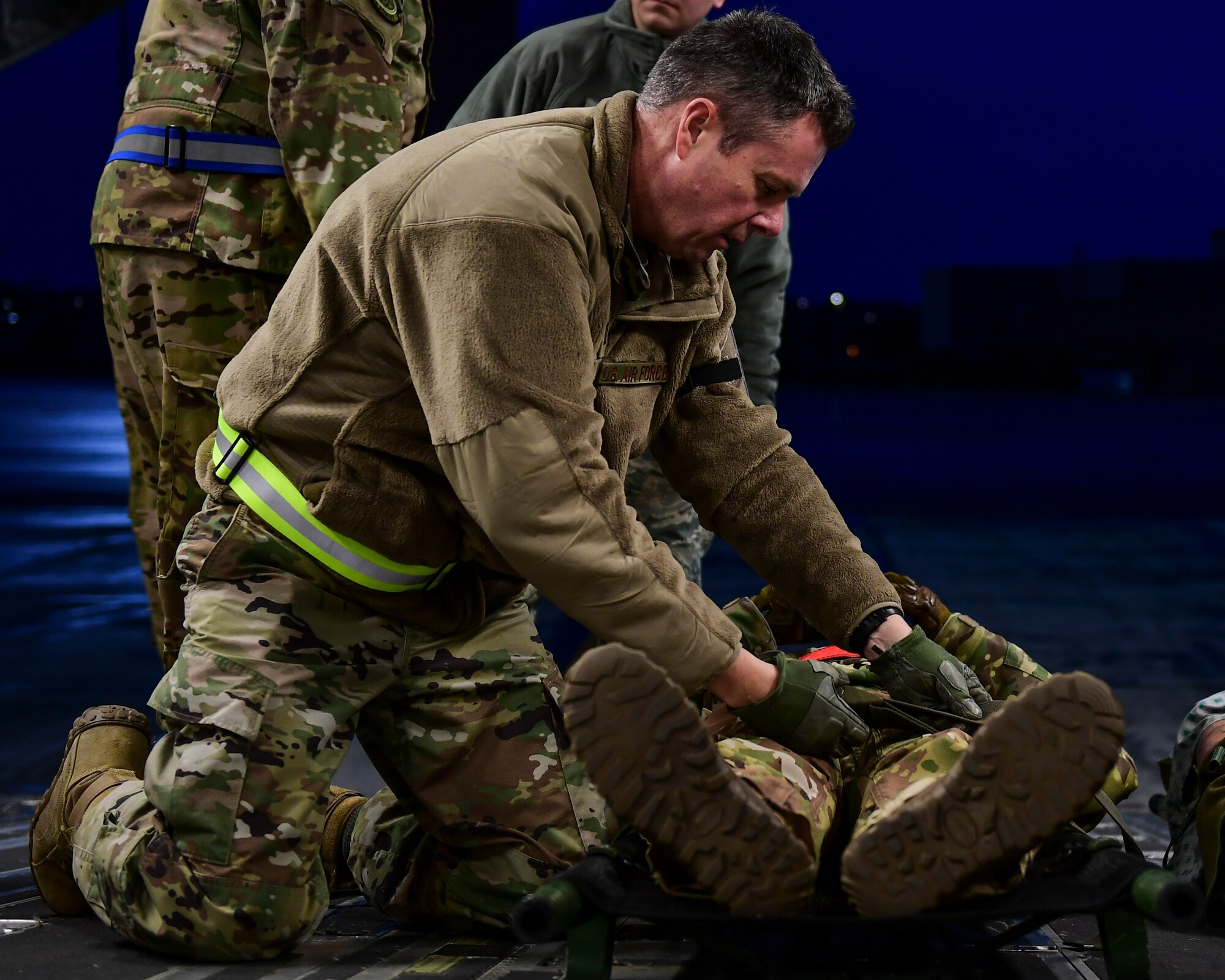 Capt. Michael J. O’Neill, medical administrative officer with the 911th Aeromedical Evacuation Squadron, straps down simulated patient Maj. Paul Blycheck, flight nurse with the 911th AES at the Pittsburgh International Airport Air Reserve Station, Pennsylvania, Jan. 16, 2020.