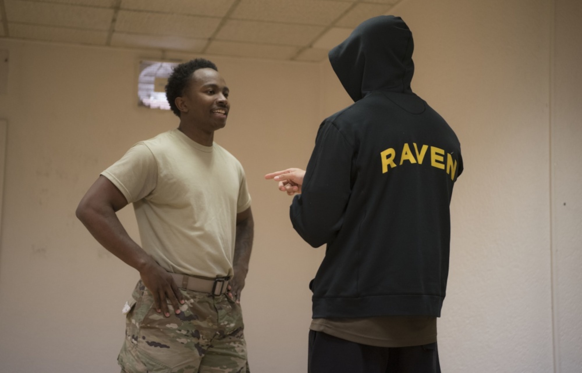 U.S. Air Force Airman 1st Class Jalen Branch, 7th Reconnaissance Squadron internal security response member and Raven applicant, stationed at Naval Air Station Sigonella, Italy, left, participates in a simulated scenario where an unauthorized individual is attempting to gain access to a restricted area, during a Raven pre-qualification course on Ramstein Air Base, Germany, Jan. 15, 2020. Branch effectively de-escalates the situation by utilizing a commonly taught law enforcement technique known as “Verbal Judo.” The Ramstein Air Base Ravens pre-qualification course, instructed by the 86th Security Forces Ravens section, tests an applicant’s ability to endure extreme mental and physical strain in preparation for the 26-day Raven qualification course at Joint Base McGuire-Dix-Lakehurst, N.J. (U.S. Air Force photo by Senior Airman Kristof J. Rixmann)