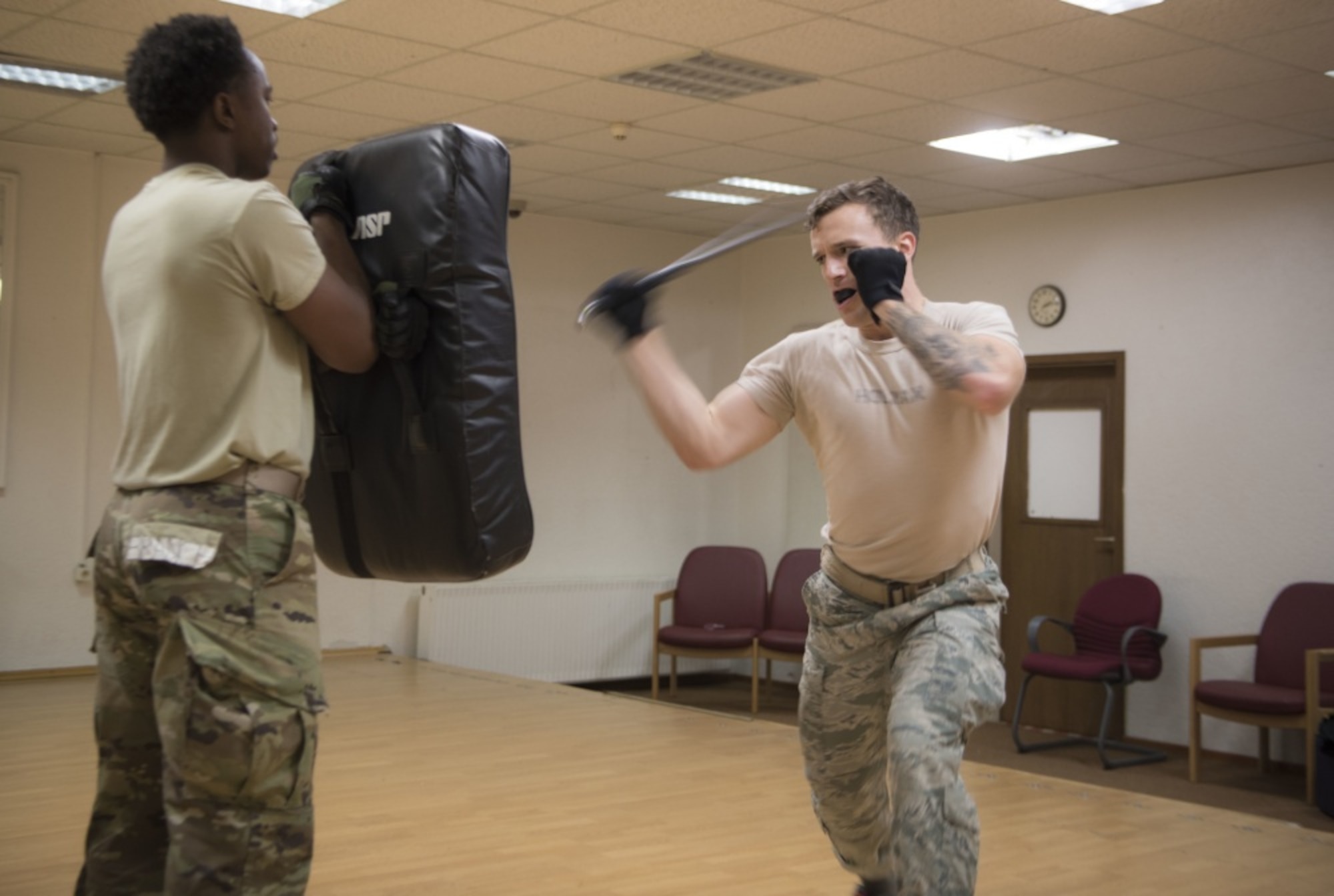 U.S. Air Force Airman 1st Class Trevor Holman, 7th Reconnaissance Squadron area supervisor and Raven applicant, stationed at Naval Air Station Sigonella, Italy, practices his baton strike with Airman 1st Class Jalen Branch, 7th RS internal security response member and Raven applicant, during a week-long Raven pre-qualification course held on Ramstein Air Base, Germany, Jan. 15, 2020. The baton training teaches how to maximize deterrence of a hostile individual, minimize exposure to the attacker, and ensure a baton strike falls within the realm of a legal strike. The Ramstein Air Base Ravens pre-qualification course tests an applicant’s ability to endure extreme mental and physical strain in preparation for the 26-day Raven qualification course at Joint Base McGuire-Dix-Lakehurst, N.J. (U.S. Air Force photo by Senior Airman Kristof J. Rixmann)