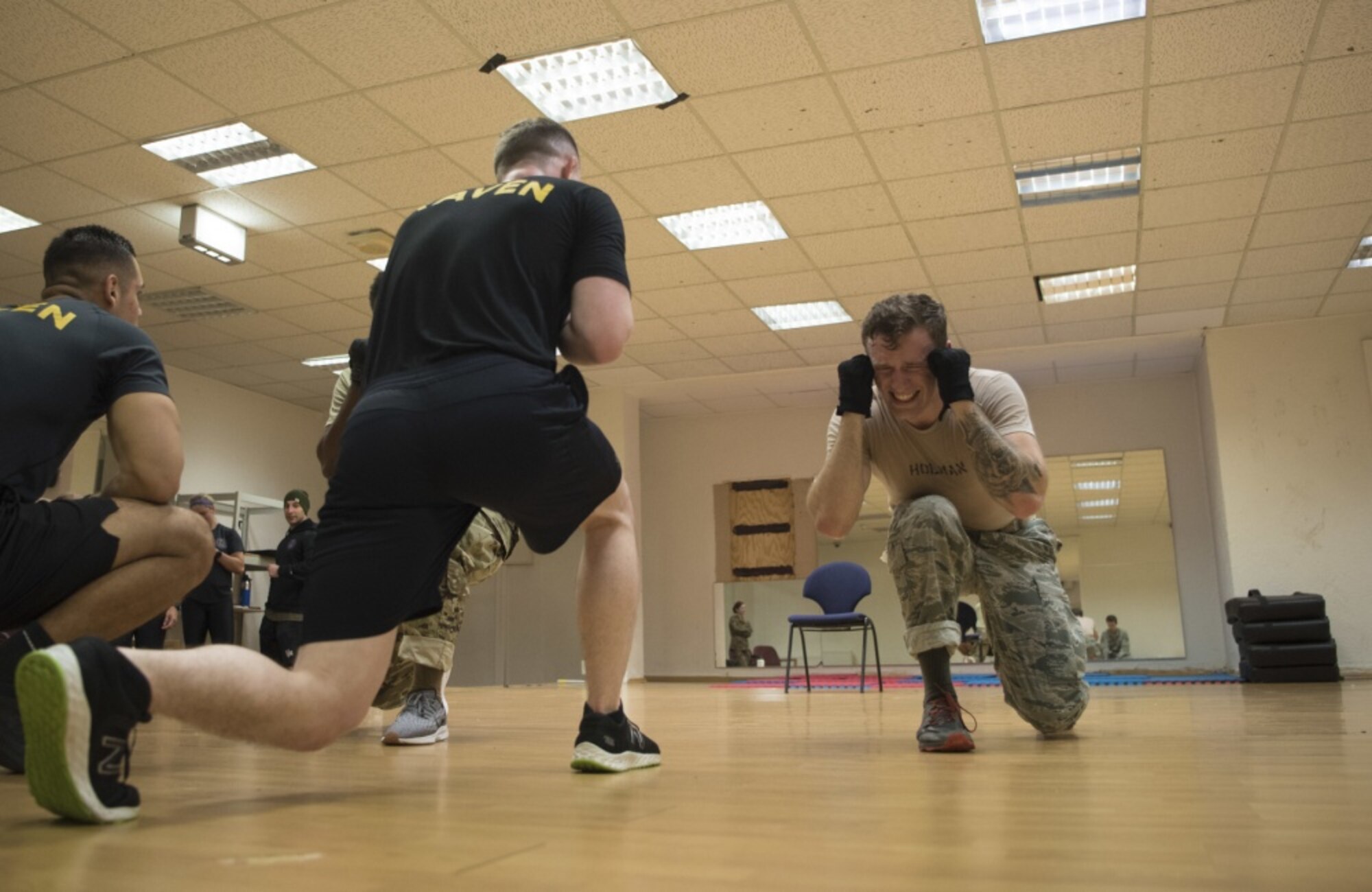 U.S. Air Force Airman 1st Class Trevor Holman, 7th Reconnaissance Squadron area supervisor and Raven applicant, stationed at Naval Air Station Sigonella, Italy, grimaces during one of hundreds of forward lunges he completed during the 86th Security Forces Ravens pre-qualification course on Ramstein Air Base, Germany, Jan. 15, 2020. The pre-qualification course tests an applicant’s ability to endure extreme mental and physical strain in preparation for the 26-day Raven qualification course at Joint Base McGuire-Dix-Lakehurst, N.J. Senior Airman Kaine Leighty, 86th Security Forces Ravens section member and Raven pre-qualification course lead instructor, said in some cases it’s almost impossible for the Raven applicants to finish every exercise to completion. Leighty said what the Ramstein Raven team does want to see from applicants is an unrelenting drive, spirit to keep going and the will to never quit. (U.S. Air Force photo by Senior Airman Kristof J. Rixmann)
