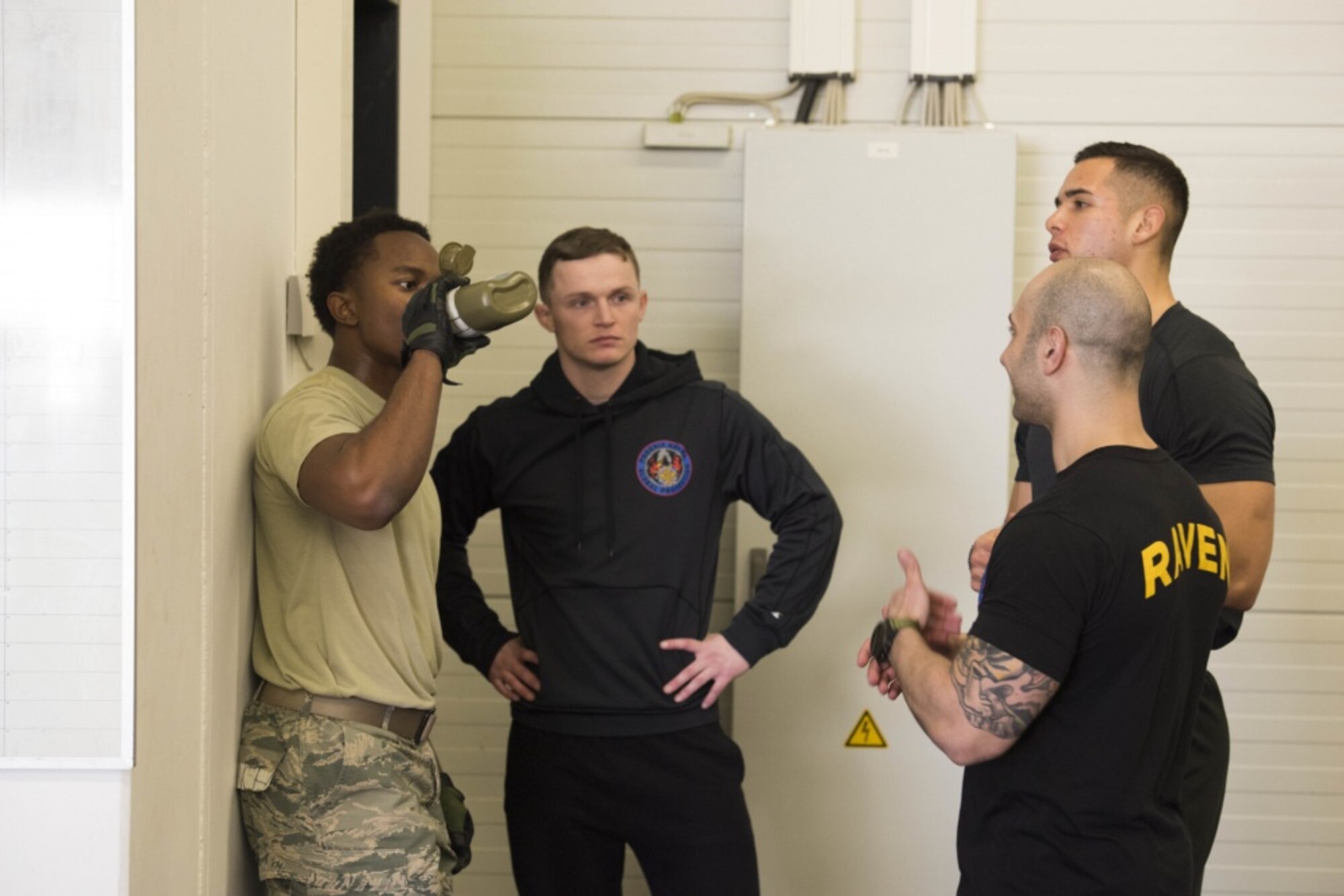 (left) U.S. Air Force Airman 1st Class Jalen Branch, 7th Reconnaissance Squadron internal security response member and Raven applicant, stationed at Naval Air Station Sigonella, Italy, receives feedback from 86th Security Forces Ravens section members after participating in the “Redman” exercise, which simulated a physical altercation with a hostile individual on Ramstein Air Base, Jan. 16, 2020. During this exercise, the risk of sustaining an injury, such as a concussion, is high, but it’s purpose is important and well-intentioned for the participating applicant. It shows the Raven applicant how they personally respond to unbridled, violent behavior. Through mentorship and reflection they learn what they can do differently if they are left to defend themselves, or others, in an actual violent situation. The Ramstein Air Base Ravens pre-qualification course, instructed by the 86th Security Forces Ravens section, tests an applicant’s ability to endure extreme mental and physical strain in preparation for the 26-day Raven qualification course at Joint Base McGuire-Dix-Lakehurst, N.J. (U.S. Air Force photo by Senior Airman Kristof J. Rixmann)
