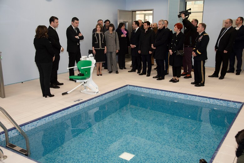 Georgian Prime Minister Giorgi Gakharia, then-Acting U.S. Ambassador Elizabeth Rood, Speaker of the Parliament Archil Talakvadze, and North Atlantic Division Commander Maj. Gen. Jeffrey Milhorn learn about how the facility’s aqua therapy pool will be used to help soldiers recover from injuries.  (U.S. Army photo by Chris Augsburger)