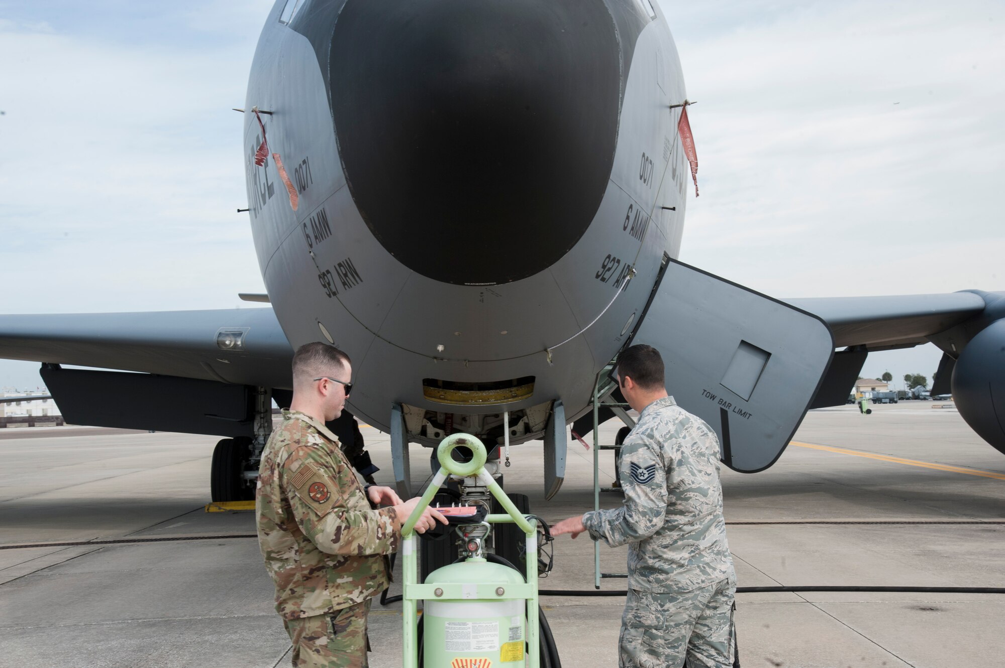 U.S. Air Force Staff Sgt. Robert Argenti (left), a 6th Aircraft Maintenance Squadron (AMXS) instrument and flight control systems craftsman, and Tech. Sgt. Wesley May (right), a 6th AMXS aerospace propulsion specialist, look over a KC-135 maintenance checklist, Jan. 23, 2020, at MacDill Air Force Base, Fla.  The 6th AMXS provides on-equipment maintenance including launch, recovery, servicing and repair of KC-135 Stratotankers.