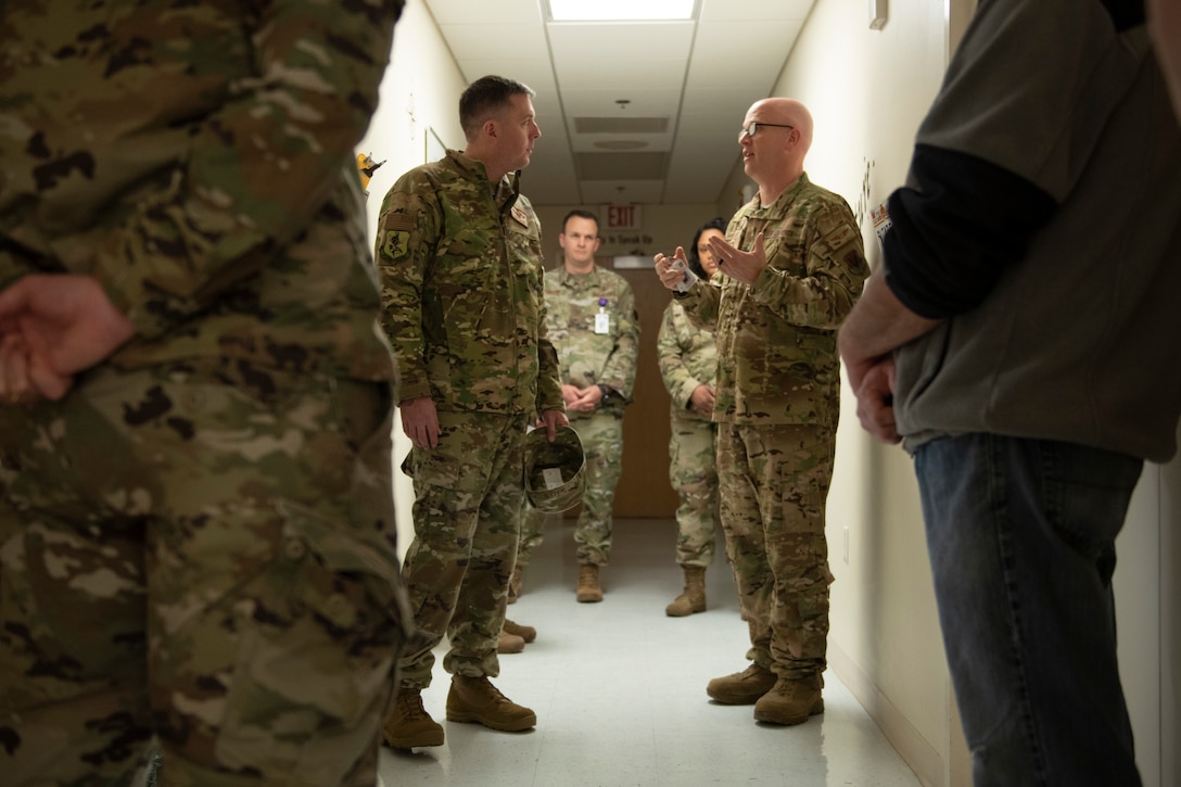 A photo of leadership talking to each other.