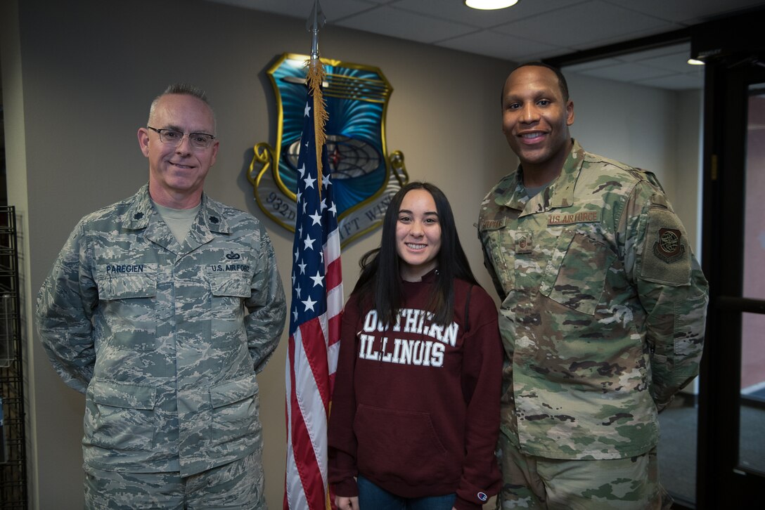 New Air Force citizen Airman, Janice Williams, center, poses with Air Force recruiter, Master Sgt. Bohannon Stephens, right, and Lt. Col.Stan Paregien, 932nd Airlift Wing Public Affairs Officer, following Williams’s oath of enlistment, Jan. 30, 2020, Scott Air Force Base, Illinois. Williams knows her dad is very proud she commented,  since her siblings have all joined the Air Force, like her father, and will have the opportunity to work with her brother, Senior Airman Jacob Williams  here in the 932nd AW when she returns from basic military training. (U.S. Air Force photo by Christopher Parr)