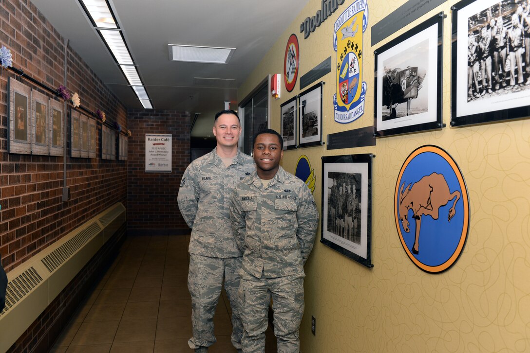 Staff Sgt. Jan Vincent Pilapil, the 28th Force Support Squadron training and production manager, at the Raider Café and Airman 1st Class Jalen Mackall, a 28th FSS Food Services journeyman, pose for a photo at Ellsworth Air Force Base, S.D., Jan. 24, 2020. Pilapil and Mackall proposed the idea of the Doolittle Raiders Memorial, as well as the B-1B Lancer Crash Site Memorial. (U.S. Air Force photo by Airman Quentin K. Marx)