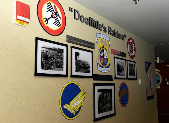 The Doolittle Raiders Memorial is revealed at the Raider Café at Ellsworth Air Force Base, S.D., Jan. 24, 2020. The memorial shows pictures of Lt. Col. James "Jimmy" Doolittle and his squadron with the aircraft, the B-25 "Mitchell," used during the April, 1942 Doolittle Raid, a brief description of the pictures and the four squadrons' patches that were responsible for the raid. (U.S. Air Force photo by Airman Quentin K. Marx)