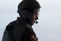 Tech. Sgt. Seth Dunworth, 15th Airlift Squadron loadmaster, prepares to deploy illumination flares and position markers from the ramp of the aircraft during Air Mobility Command Test and Evaluation Squadron’s assessment of tactics, techniques and procedures for astronaut rescue and recovery efforts Jan. 22, 2020, off the coast of Florida near Patrick Air Force Base.