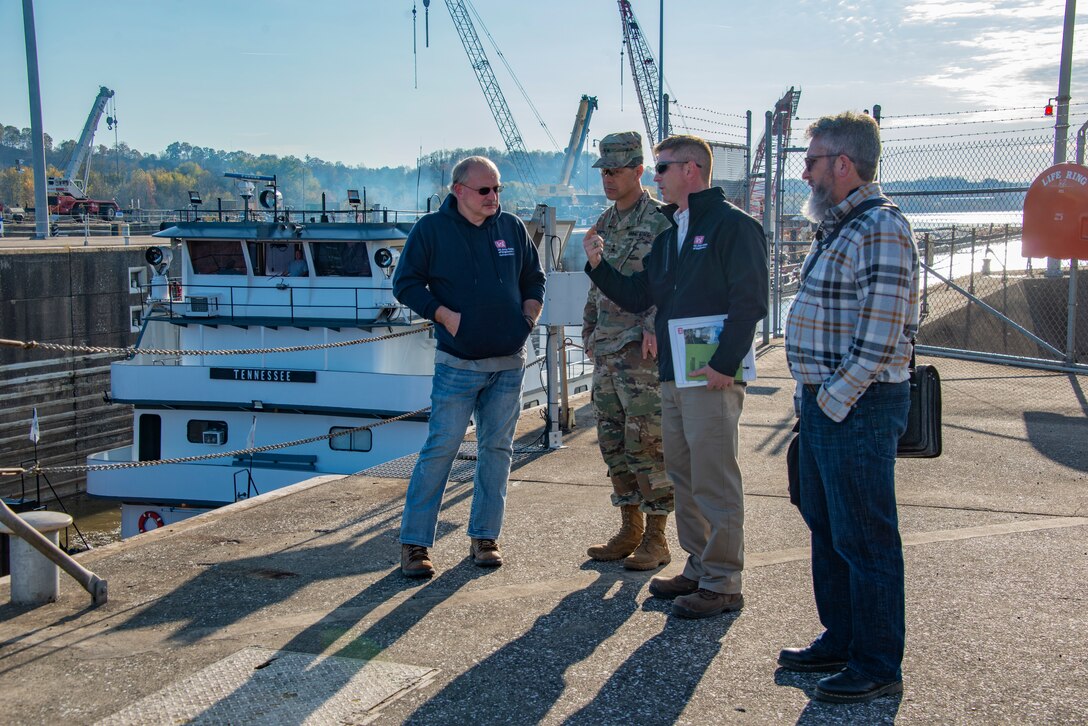 A group of employees from the U.S. Army Corps of Engineers take part in a tour of Bluestone Dam