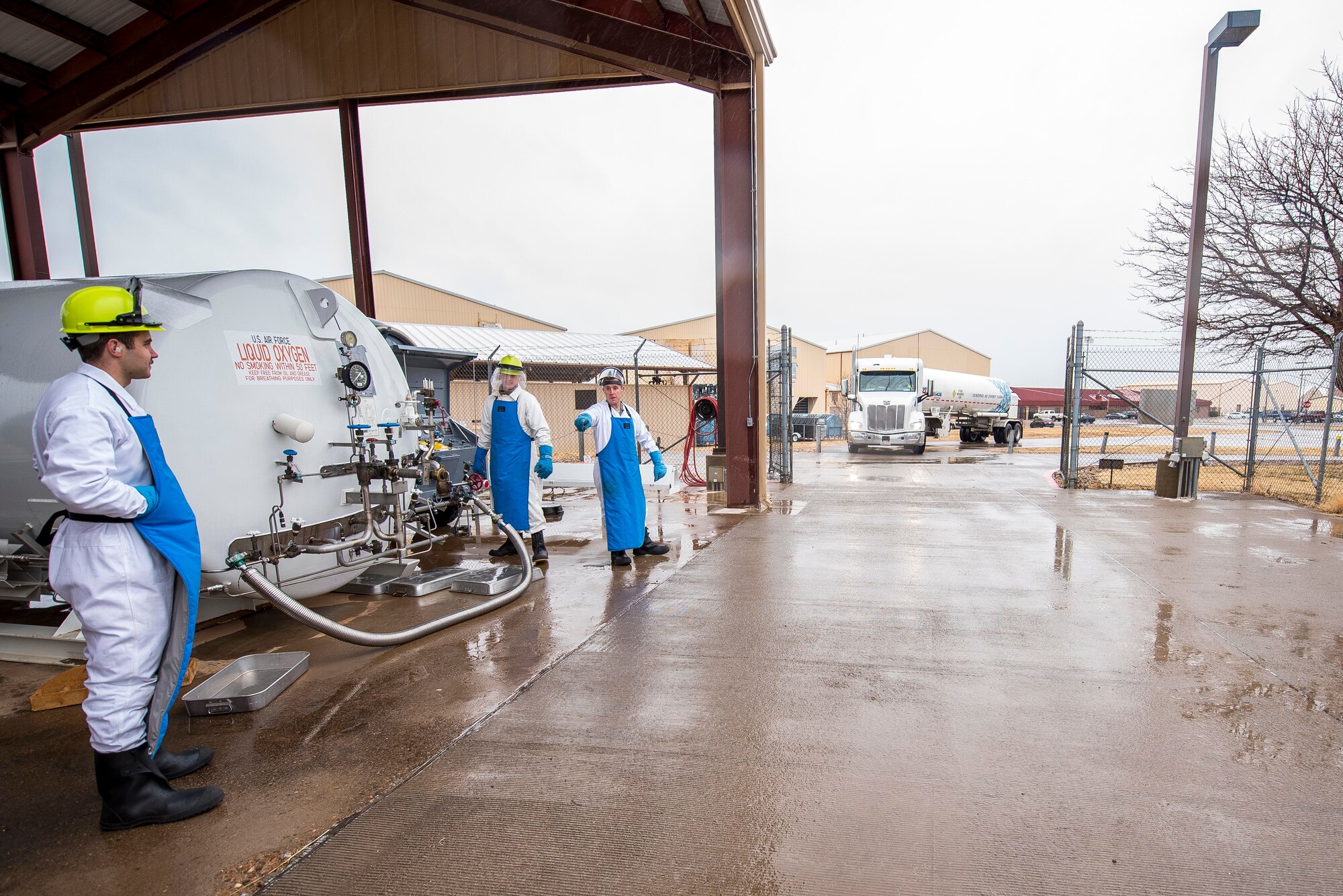 The 27th Special Operations Logistics Readiness Squadron cryogenics team prepares to unload liquid oxygen off of an oncoming semi-truck at Cannon Air Force Base, New Mexico, Jan. 21, 2020. The cryogenics team has to be able to fill oxygen tanks or unload oxygen tanks 24/7. (U.S. Air Force photo by Senior Airman Vernon R. Walter III)