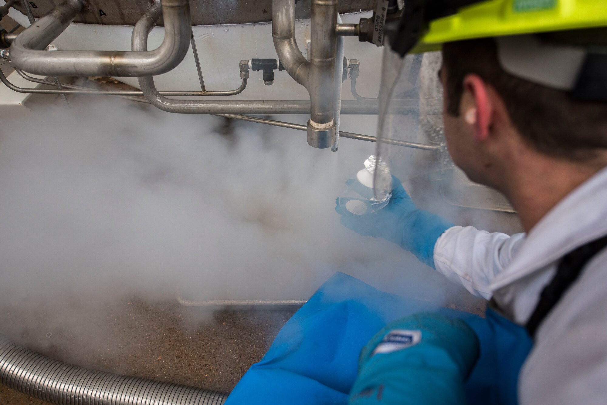 Airman 1st Class Daniel Sage, 27th Special Operations Logistics Readiness Squadron fuels facilities technician, prepares to get a sample of liquid oxygen to check for impurities at Cannon Air Force Base, New Mexico, Jan. 21, 2020. The samples are taken to ensure there are no impurities in the liquid oxygen. (U.S. Air Force photo by Senior Airman Vernon R. Walter III)