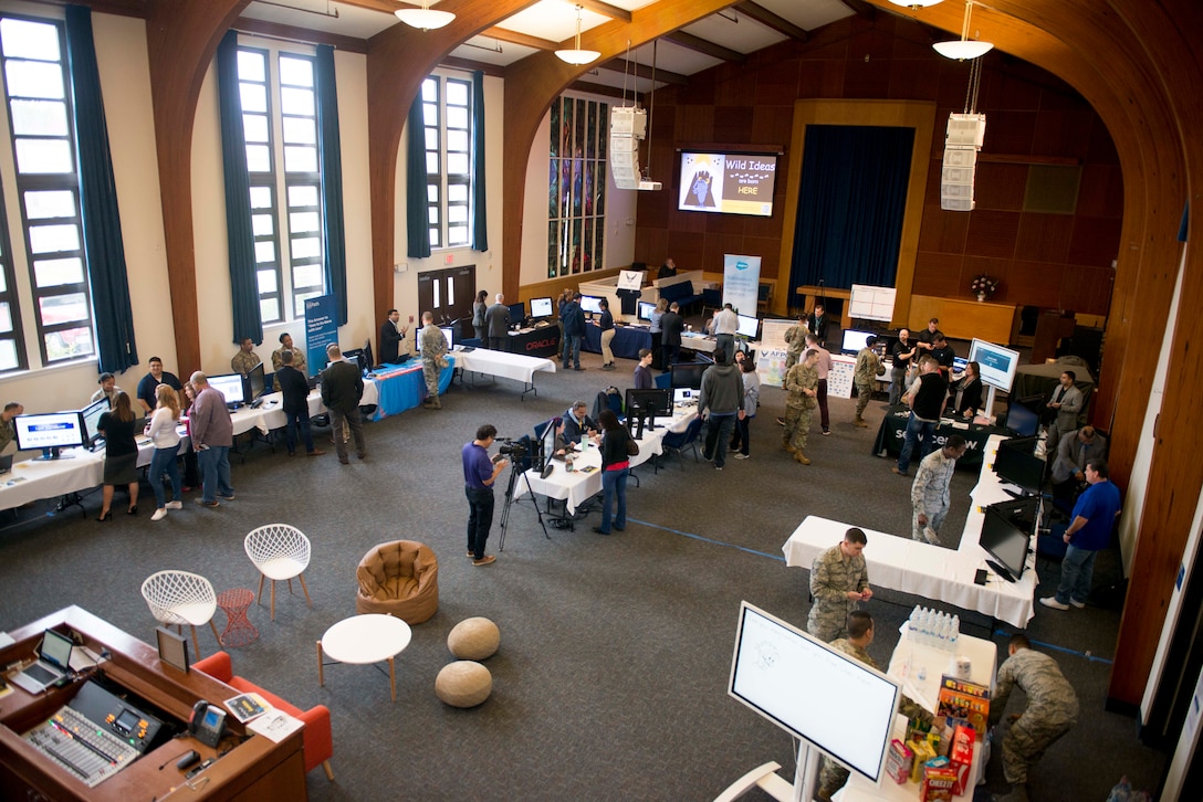 A photograph of a room filled with members gathering during an expo at AFPC’s inaugural Innovation Symposium