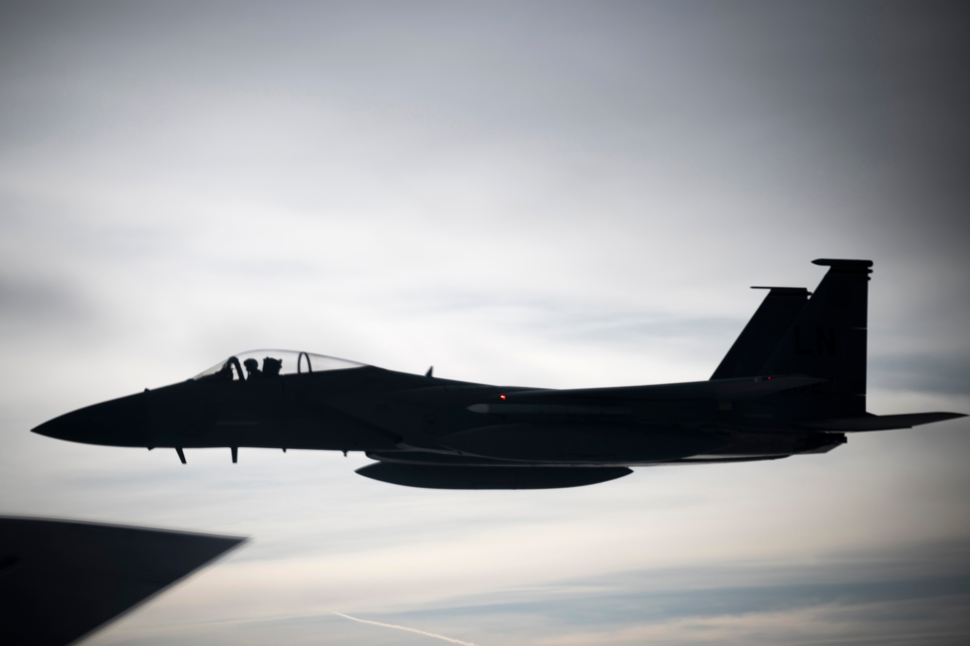 A U.S. Air Force F-15C Eagle assigned to the 48th Fighter Wing, RAF Lakenheath, England, waits to be refueled next to a KC-135 Stratotanker from the 100th Air Refueling Wing, RAF Mildenhall, England, during exercise Point Blank off the English coast, Jan. 30, 2020. The exercise is a recurring large-force exercise designed and co-hosted by the Royal Air Force and the 48th Fighter Wing. (U.S. Air Force photo by Tech. Sgt. Emerson Nuñez)