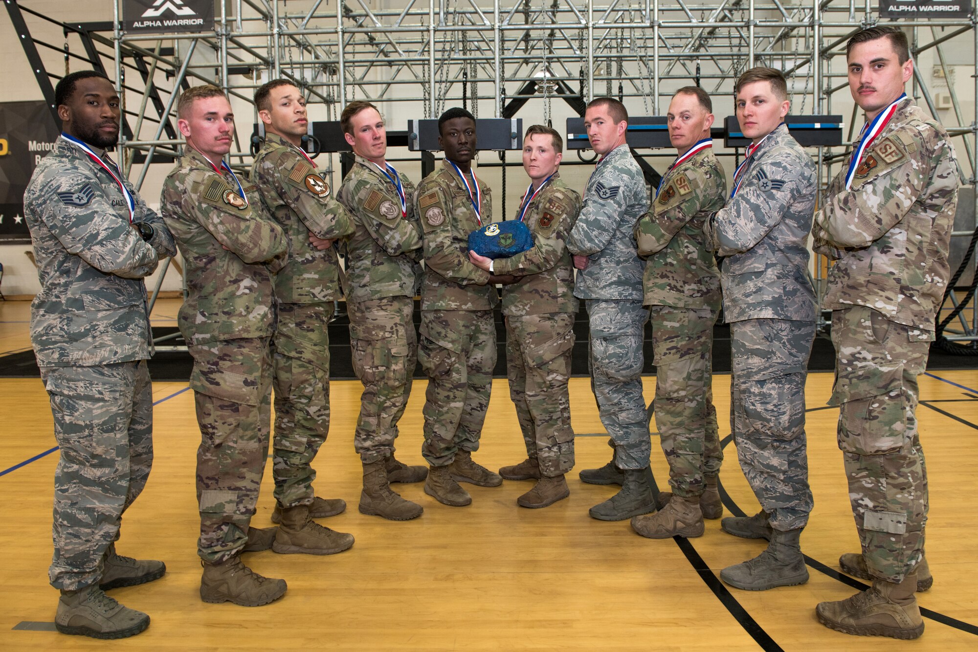 U.S. Air Force Security Forces Airmen pose for a photo after being selected to represent AETC’s team, Jan. 31, 2020, at Joint Base San Antonio-Medina Annex. The seven selectees to the AETC team will represent the First Command at the career field’s world-wide competition that will be held at JBSA-Camp Bullis in May 2020. (From left to right) Staff Sgt. Isreael Camille (alternate), 37th Training Support Squadron, JBSA-Lackland; Senior Airman Jonathan Hardy, 97th Security Forces Squadron, Altus Air Force Base, Okla.; Senior Airman Craig Smith, 71st Security Forces Squadron, Vance Air Forces Base, Okla.; Airman 1st Class Ryan Franklin, 802nd Security Forces Squadron, JBSA-Lackland; Staff Sgt. Wilson Brantley, 802nd Security Forces Squadron military working dog handler, JBSA-Lackland; Staff Sgt. William McLaughlin, 502nd Security Forces Squadron, JBSA-Ft. Sam Houston; Staff Sgt. Jesse Daniel, 81st Security Forces Squadron; Master Sgt. Sean McDermott (alternate), 56th Security Forces Squadron, Luke Air Force Base, Ariz.; Senior Airman Paul Cupp, 42nd Security Forces Squadron, Maxwell-Gunter Air Force Base, Ala.; Senior Airman Andrew Vance (alternate), 902nd Security Forces Squadron military working dog handler, JBSA-Randolph. (U.S. Air Force photo by Sarayuth Pinthong)
